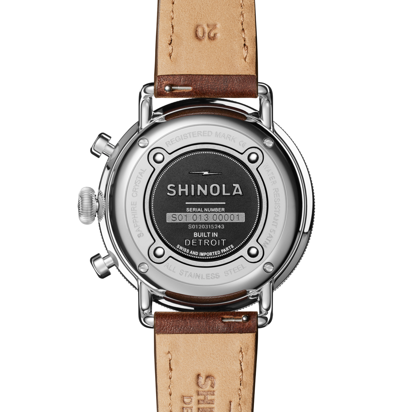 The back of a Shinola Canfield Chronograph Watch with a Cattail leather strap features the stainless steel case displaying the Shinola logo, serial number, “Built in Detroit,” and other specifications.