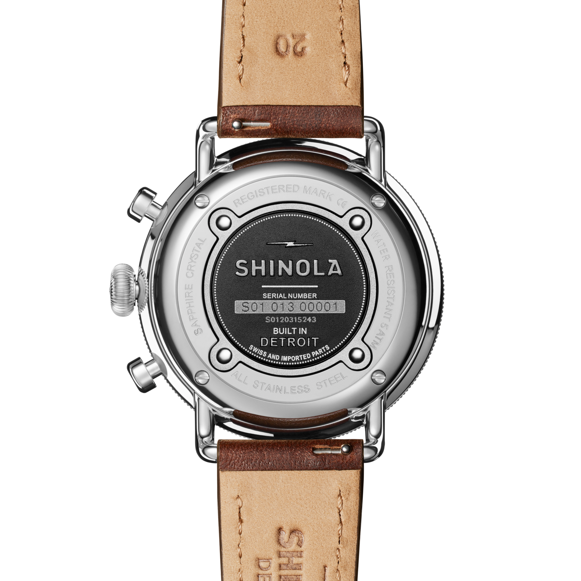 The back of a Shinola Canfield Chronograph Watch with a Cattail leather strap features the stainless steel case displaying the Shinola logo, serial number, “Built in Detroit,” and other specifications.