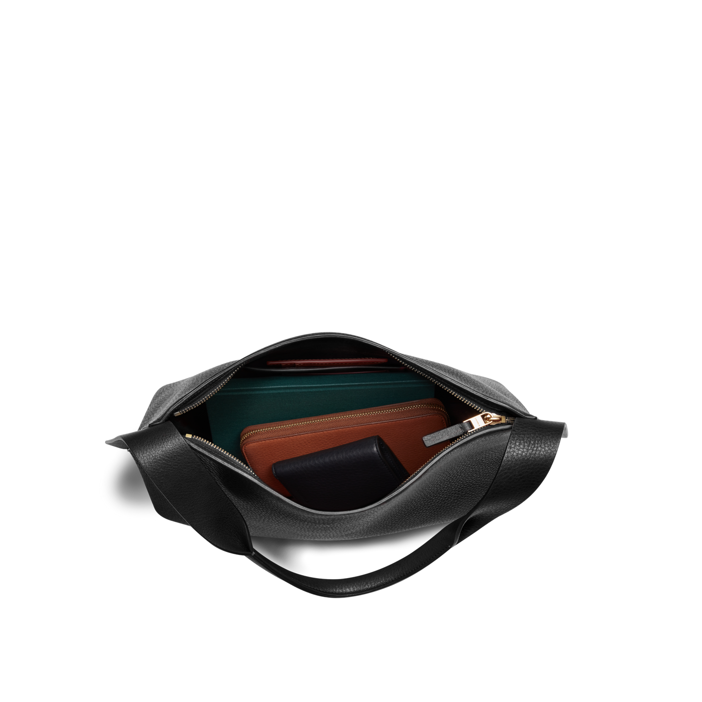 A black Shinola Medium Derby Shoulder Bag, shown from above with its zip open, displays neatly organized wallets and small items inside against a white background.
