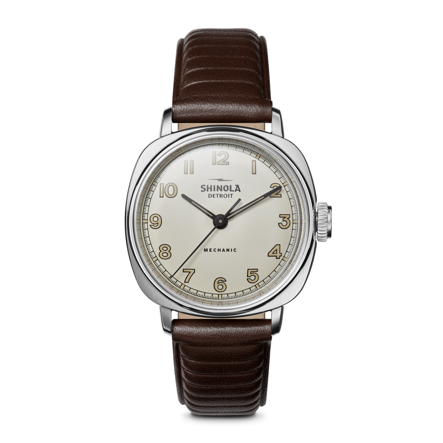 The Shinola Mechanic Watch - Alabaster features a hand-wound movement, round white dial with gold numerals, silver case, and brown leather strap. “MECHANIC” is above 6 o’clock. Displayed on a white background.