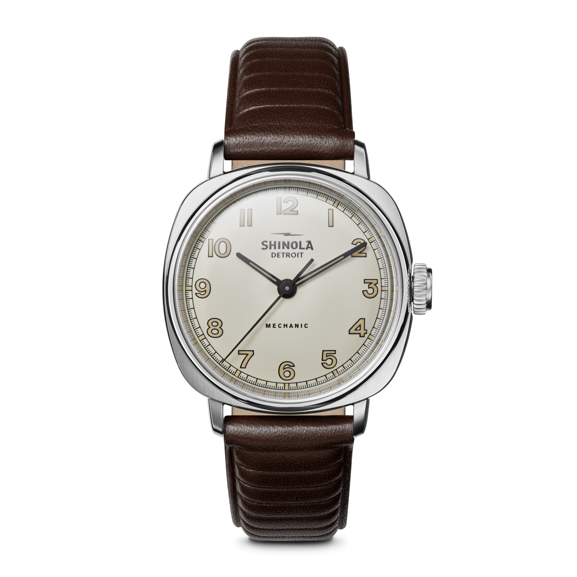 The Shinola Mechanic Watch - Alabaster features a hand-wound movement, round white dial with gold numerals, silver case, and brown leather strap. “MECHANIC” is above 6 o’clock. Displayed on a white background.