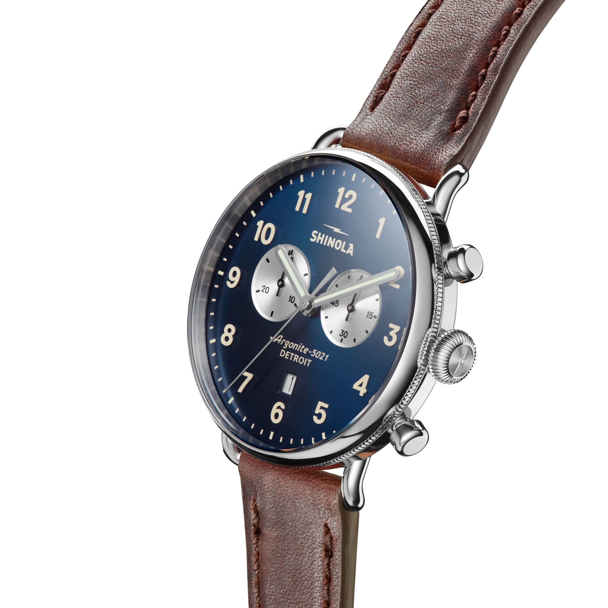 The Shinola Canfield Chronograph Watch with a blue face, silver case, Cattail leather strap, white numerals, and two silver subdials is shown at an angle against a plain white background.