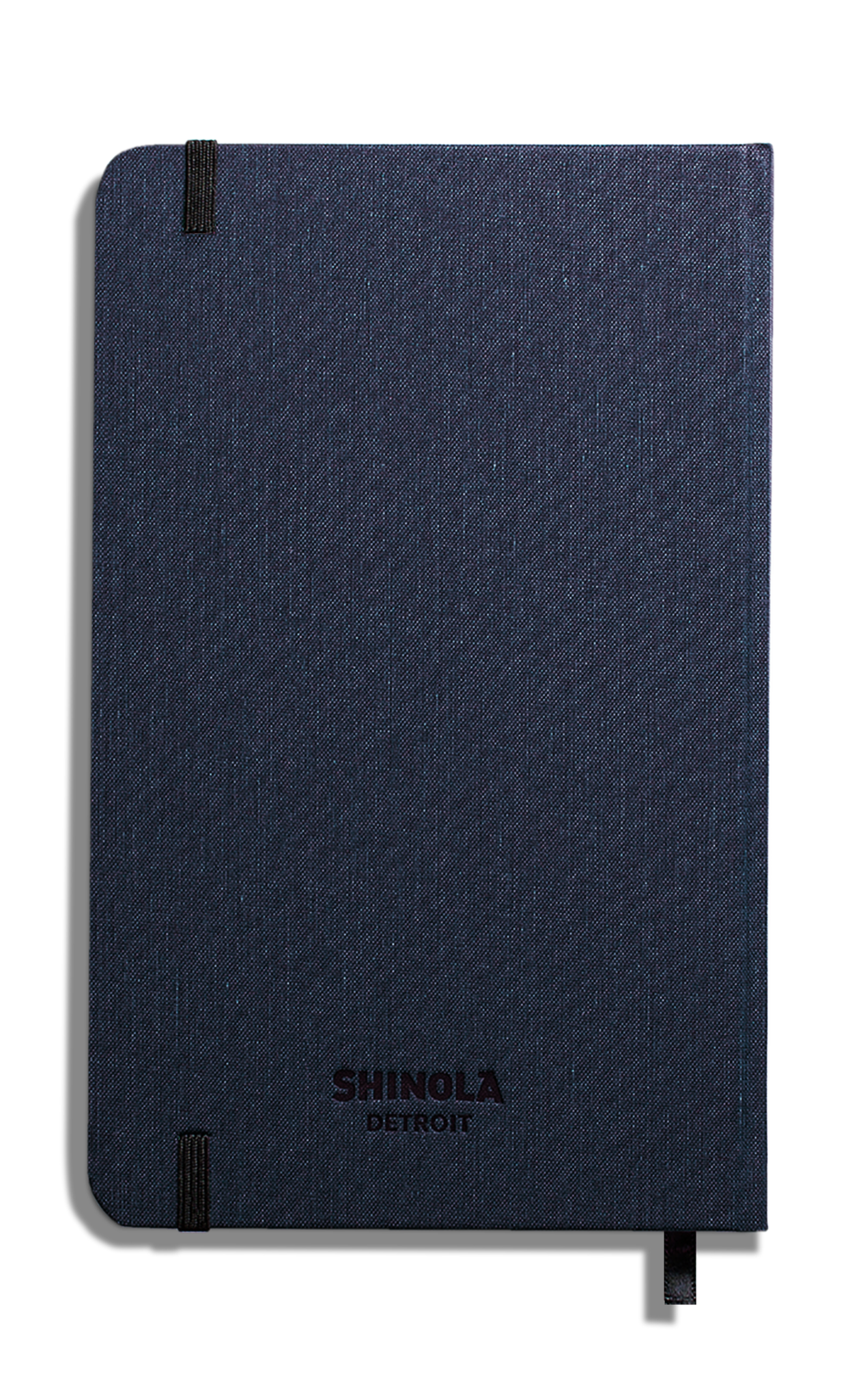 The Shinola Medium Hard Grid Journal - Navy is a dark blue hardcover notebook with rounded corners, smyth-sewn binding, elastic bands on two corners, and "Shinola Detroit" printed in black on the front.