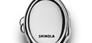 A close-up of the Heirloom Statement Locket Necklace in sterling silver by Shinola, featuring an oval shape and a SHINOLA engraving, shown against a plain white background.