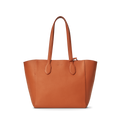 The Shinola Runabout Tote Bag - Rust is crafted from brown pebbled leather, has two straps, an embossed front logo, and includes an interior zipper pouch for convenience.