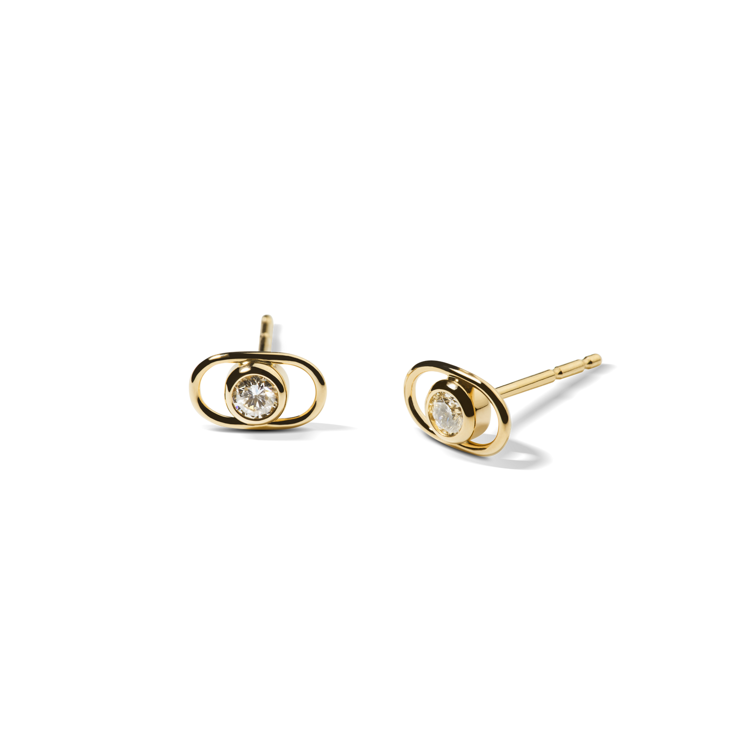 The Shinola Diamond Rivet Oval Stud Earrings in 14k yellow gold feature a central round diamond framed by an oval gold setting, shown against a plain white background.
