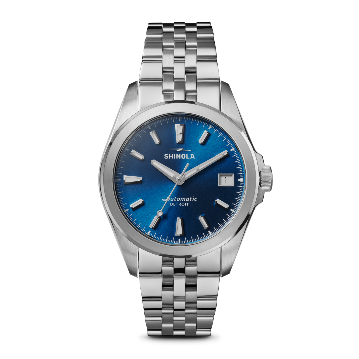 The Shinola Circadian Monster Automatic Watch - Daylight Blue features a stainless steel case, blue sunray dial, silver markers and hands, Swiss movement, date at 3 o'clock, and a metal link bracelet.
