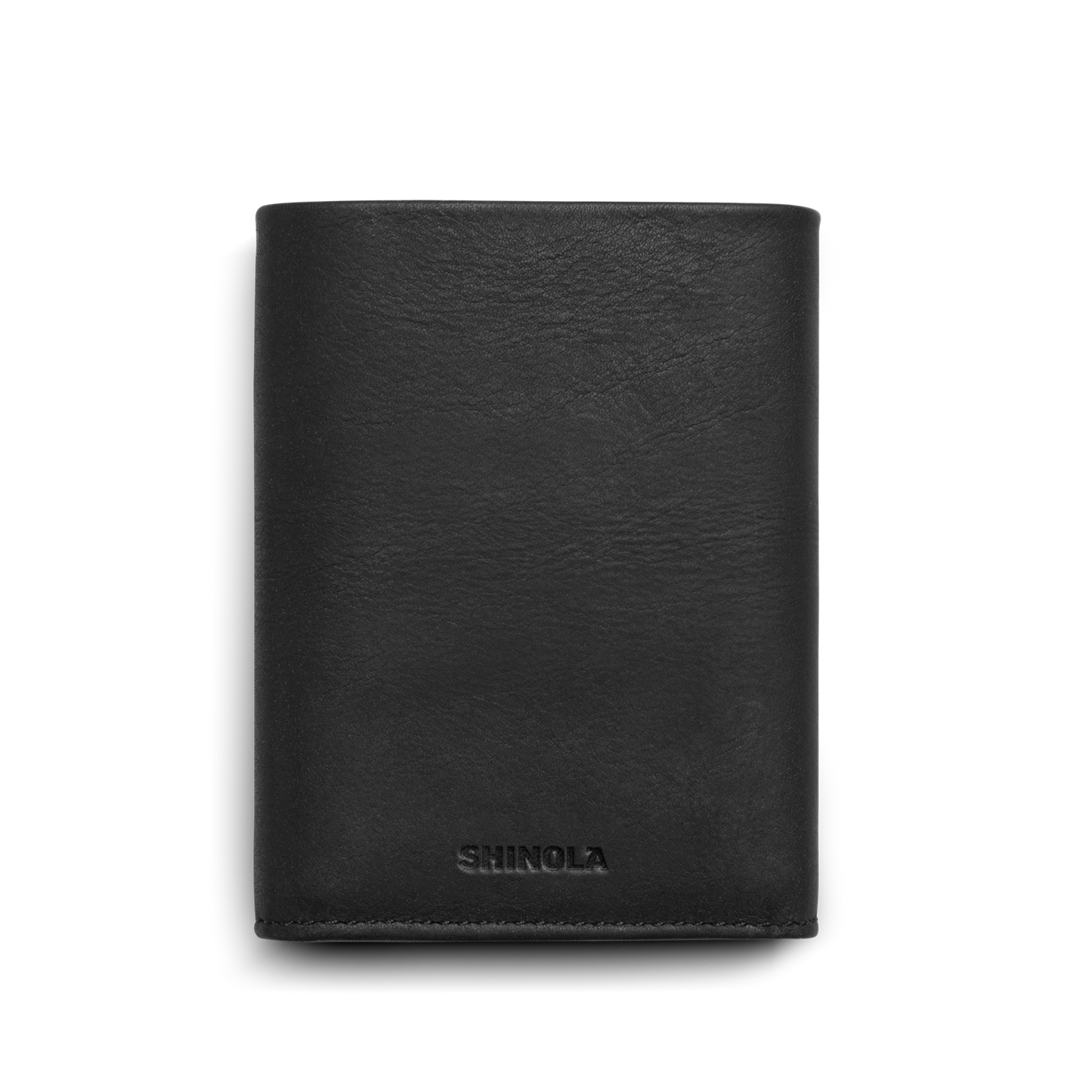 A Shinola Trifold Wallet - Black, crafted from smooth leather and embossed with "SHINOLA" near the bottom, is shown folded closed against a plain white background.