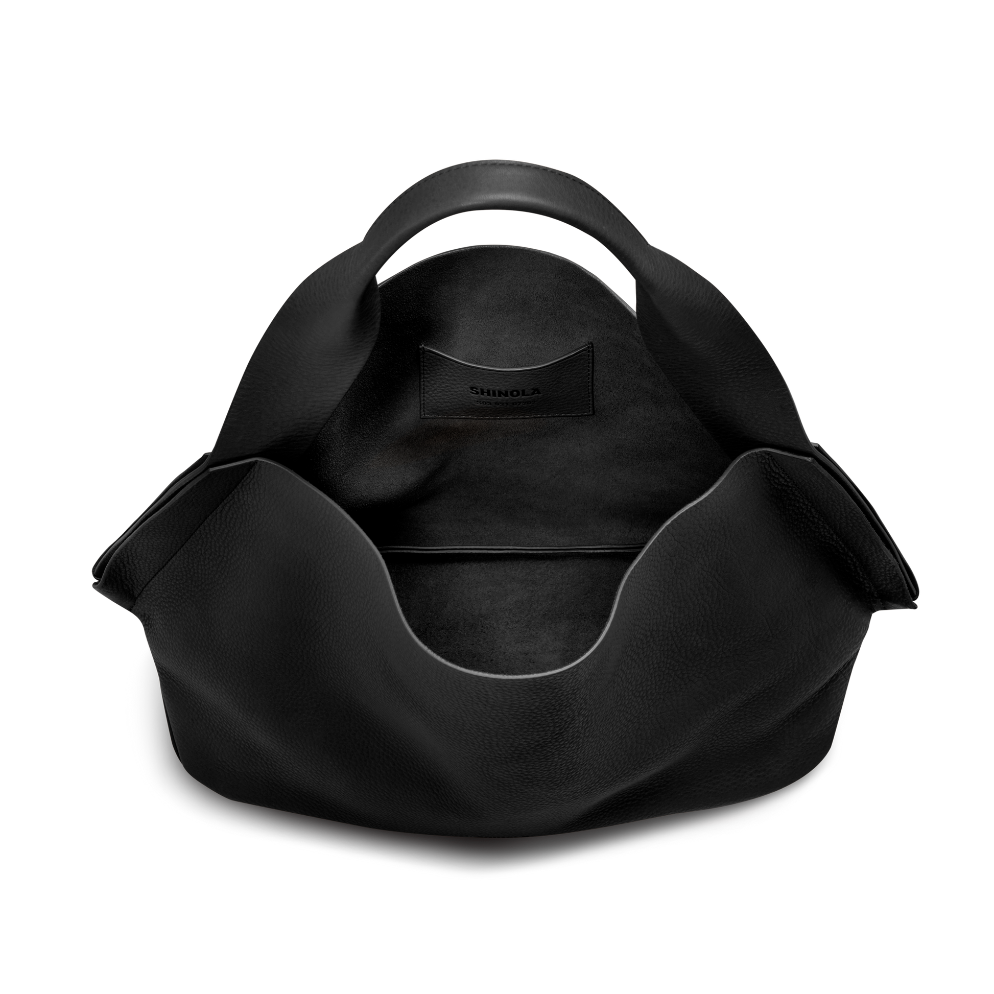 The Shinola Derby Shoulder Bag - Black is a large tote featuring curved handles, a wide open top, and a leather card pocket in its spacious main compartment, shown against a plain white background.