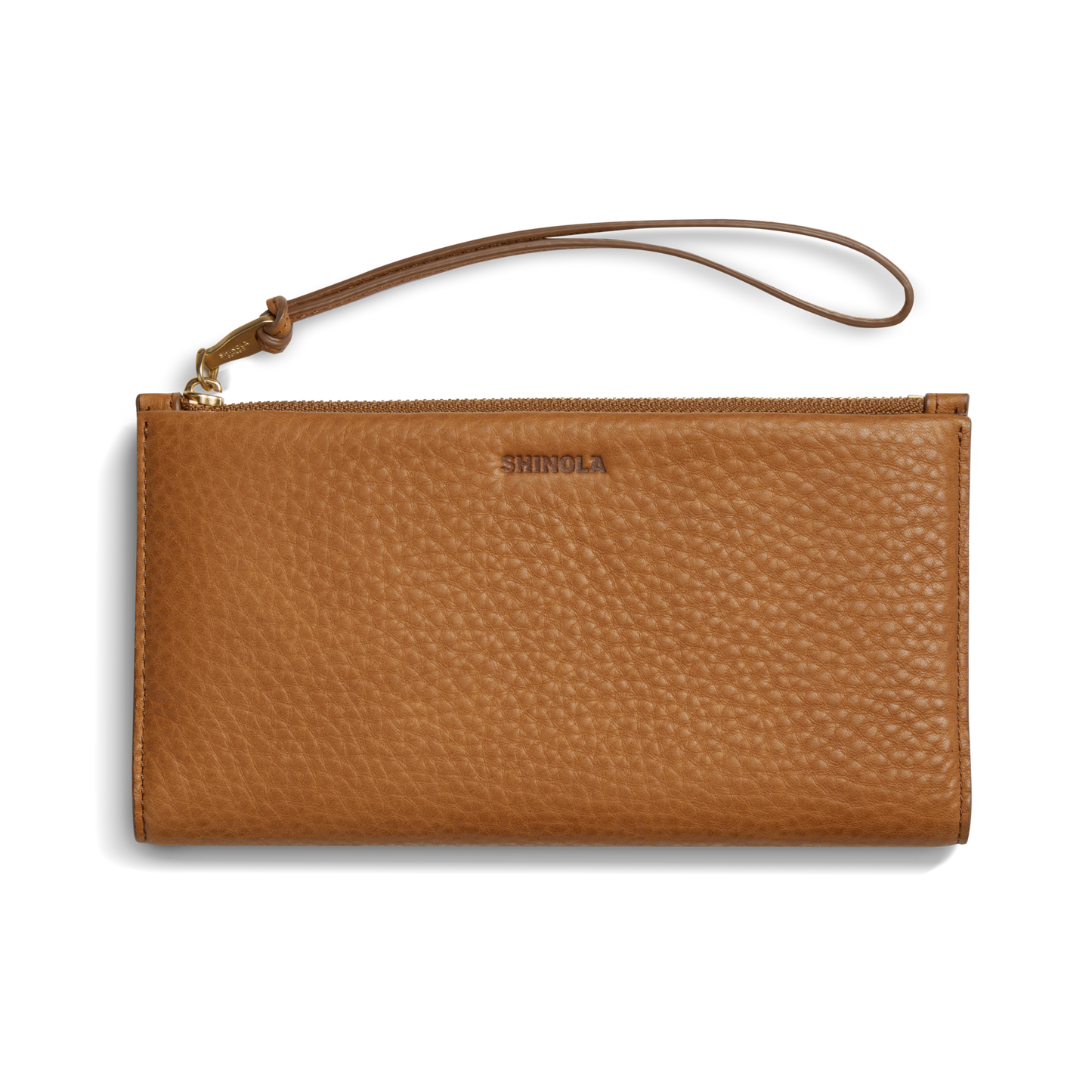 The Shinola Wristlet Wallet - Tan features textured natural grain leather, a wrist strap, zipper closure, and an embossed logo on the front, displayed against a white background.