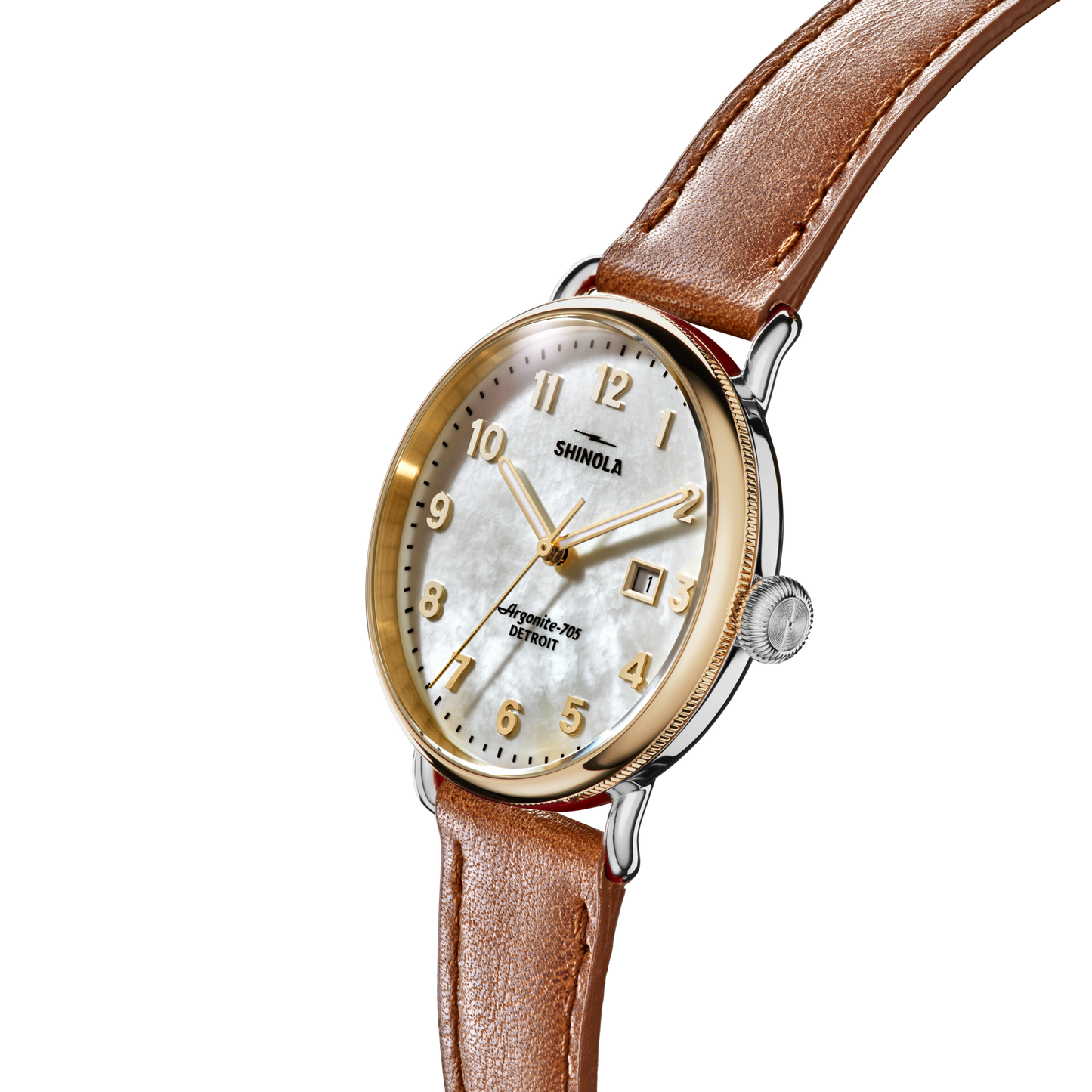 The Shinola Canfield Watch features a tan leather strap, gold and silver case, white mother-of-pearl dial, gold numerals and hands, displayed at an angle against a plain white background.