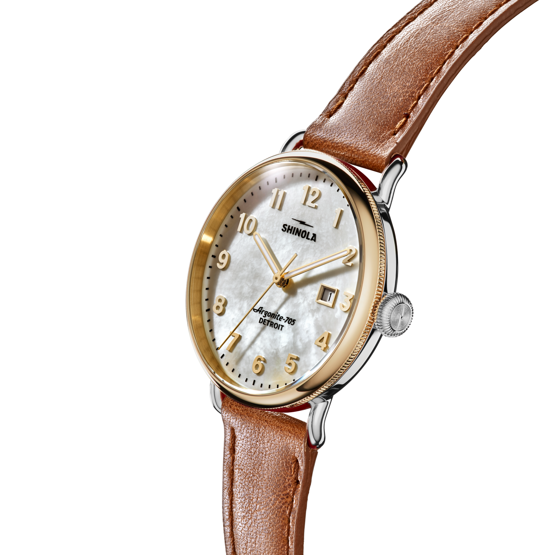 The Shinola Canfield Watch features a tan leather strap, gold and silver case, white mother-of-pearl dial, gold numerals and hands, displayed at an angle against a plain white background.