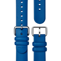 Two Shinola 20mm Rubber Straps in Blue Dash Loop are displayed on a white background. One is longer with multiple holes, the other shorter featuring a stitched logo near the end; both have silver buckles.