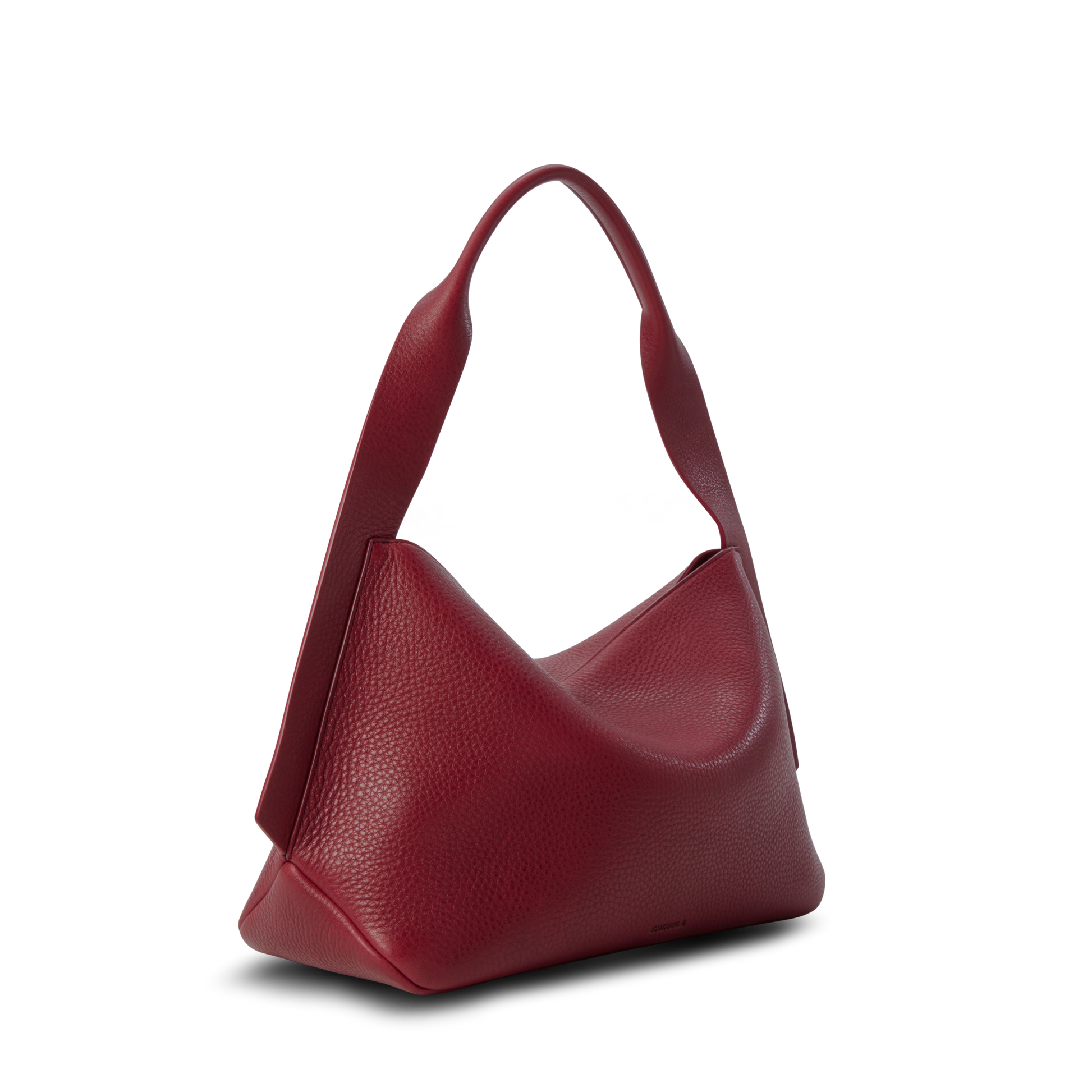 The Shinola Medium Derby Shoulder Bag - Ruby, featuring natural grain leather and a single strap, is displayed against a white background.