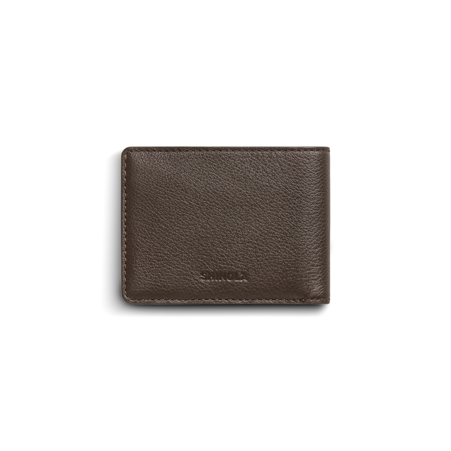 The Shinola Canfield ID Bifold Wallet in Espresso features brown pebbled leather with visible edge stitching and a subtle Shinola logo embossed on the lower front, shown closed against a white background.