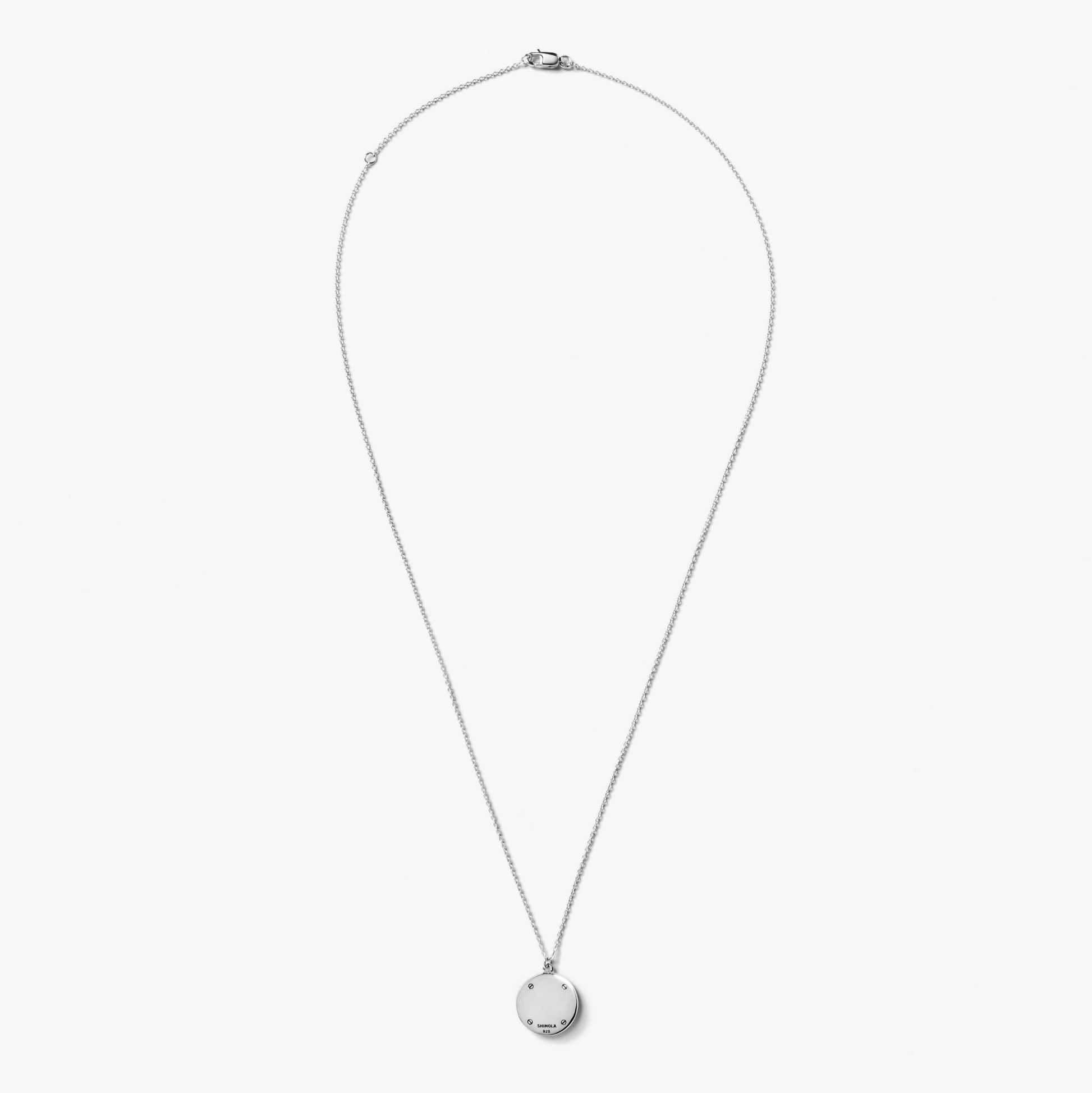 The Shinola Heirloom Turquoise Pendant Necklace features a delicate round turquoise pendant on a sterling silver chain, displayed against a plain white background. A refined piece of engraved jewelry perfect for any occasion.