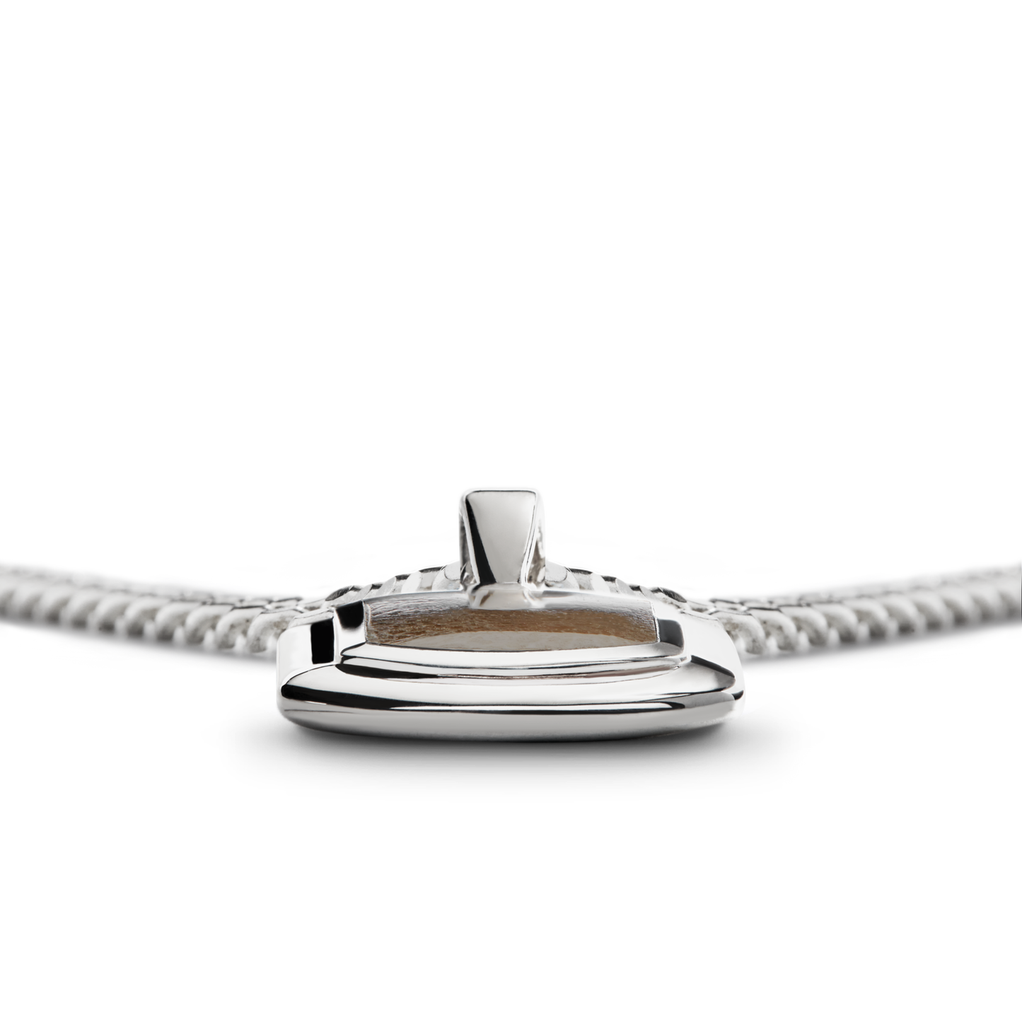 A close-up of the Shinola Petoskey Tag Necklace in sterling silver, featuring a smooth, oval-shaped pendant on a matching chain, displayed against a white background.