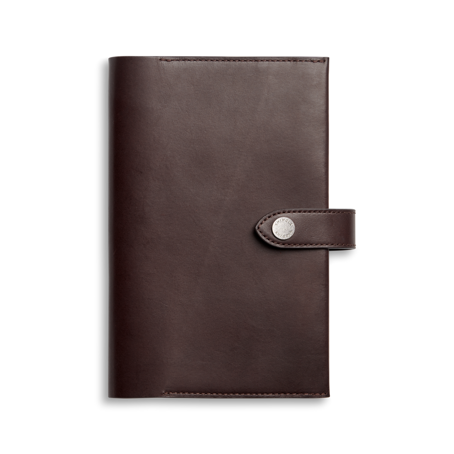 The Shinola Medium Snap Journal Cover in dark brown Vachetta leather features a flap closure with a round silver snap, shown against a plain white background.