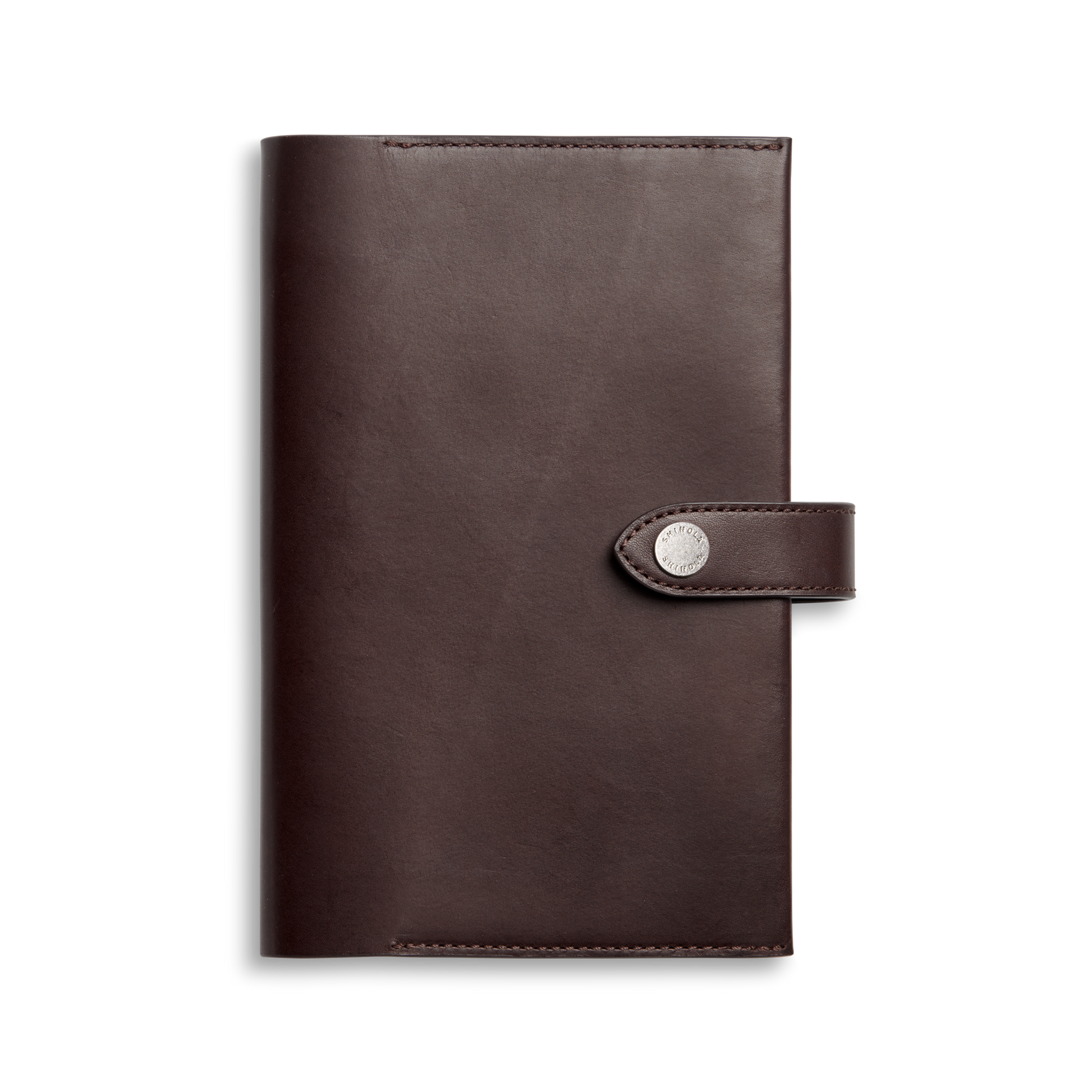 The Shinola Medium Snap Journal Cover in dark brown Vachetta leather features a flap closure with a round silver snap, shown against a plain white background.