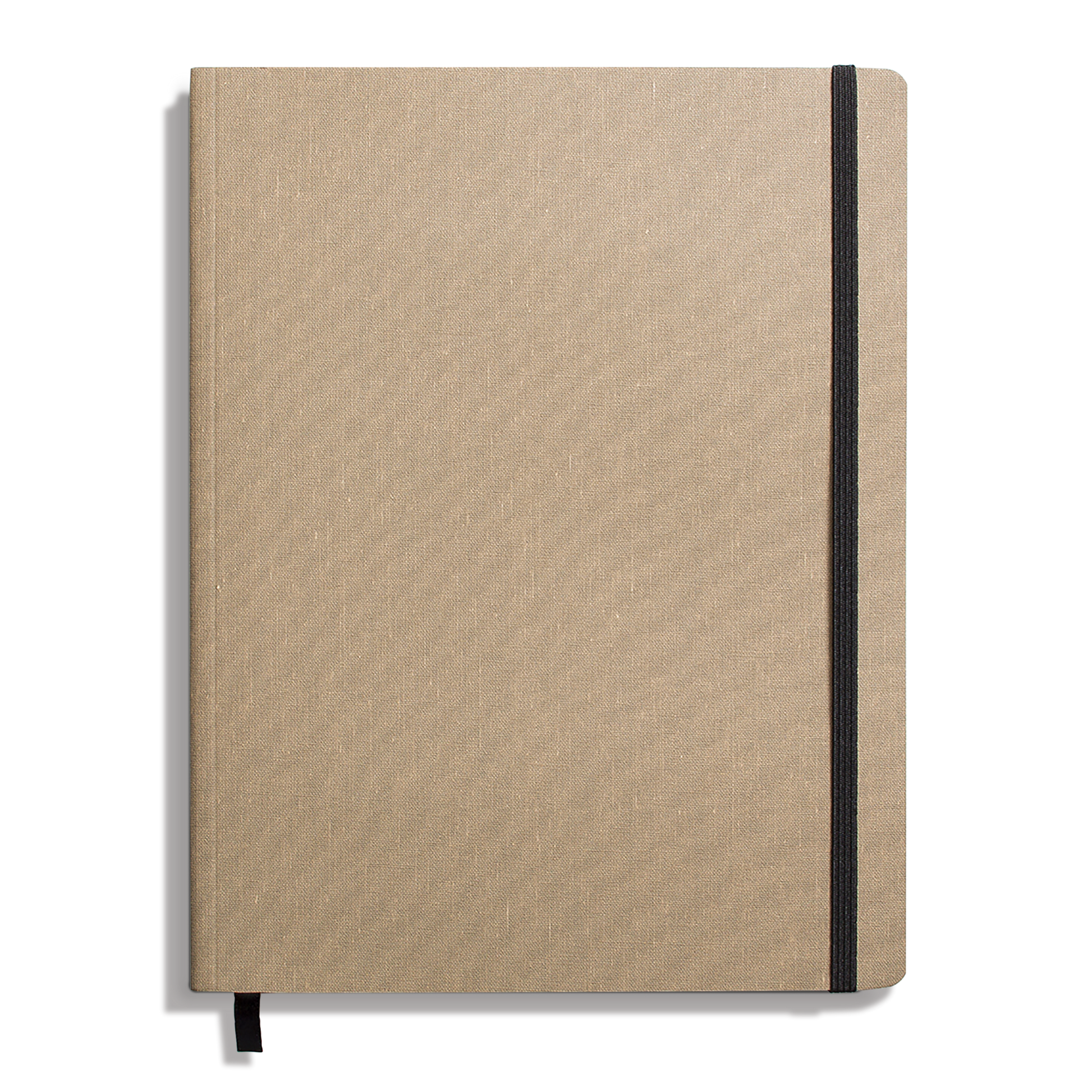The Shinola Large Soft Ruled Journal in Oat features a textured tan linen cover, black elastic closure, ribbon bookmark, and acid-free pages. The closed journal is shown on a white background.