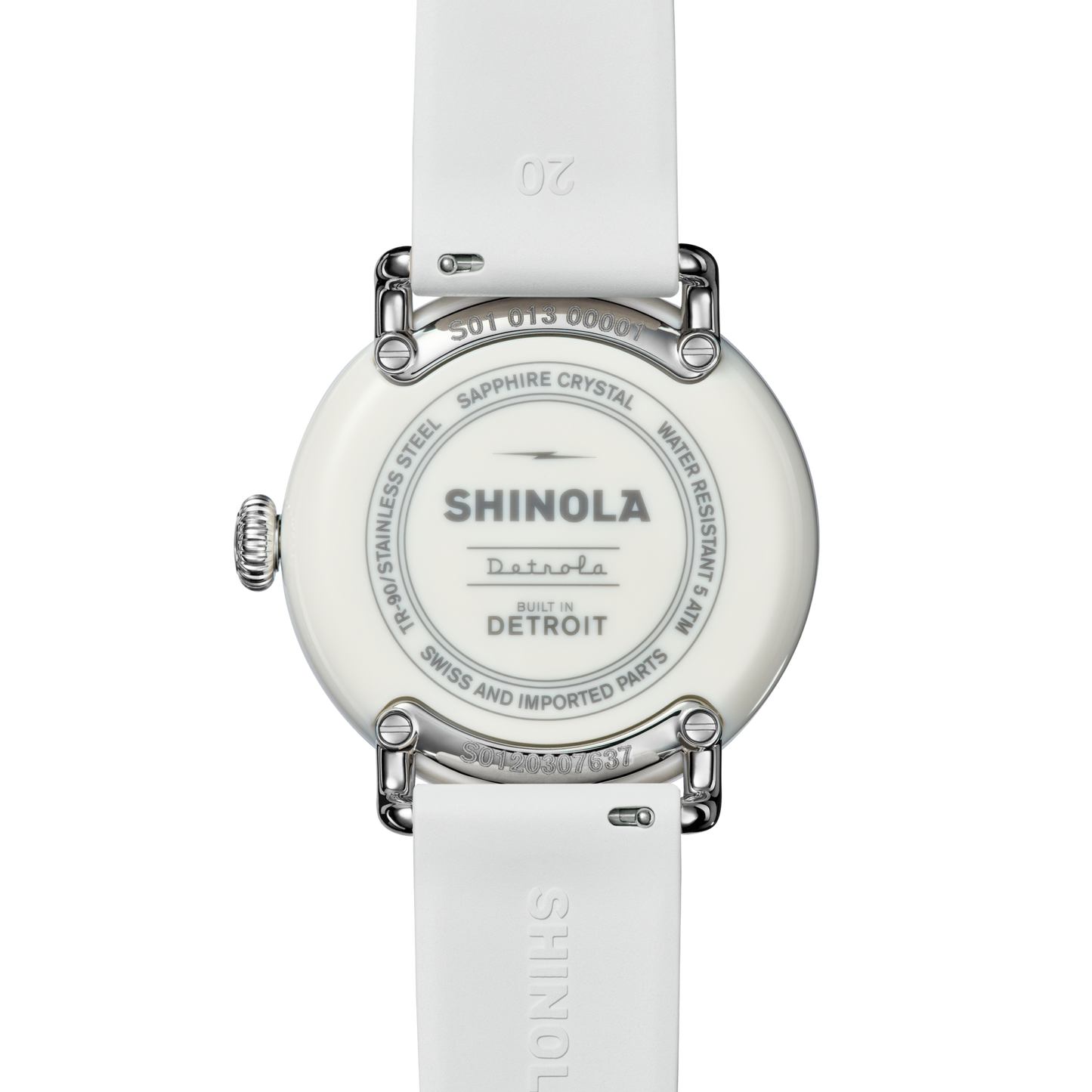 Back view of the Shinola Detrola Watch - Nude, featuring a white strap and an engraved case back: "Shinola Detroit, Built in Detroit, Swiss and Imported Parts, Stainless Steel, Sapphire Crystal, Water Resistant 5ATM.