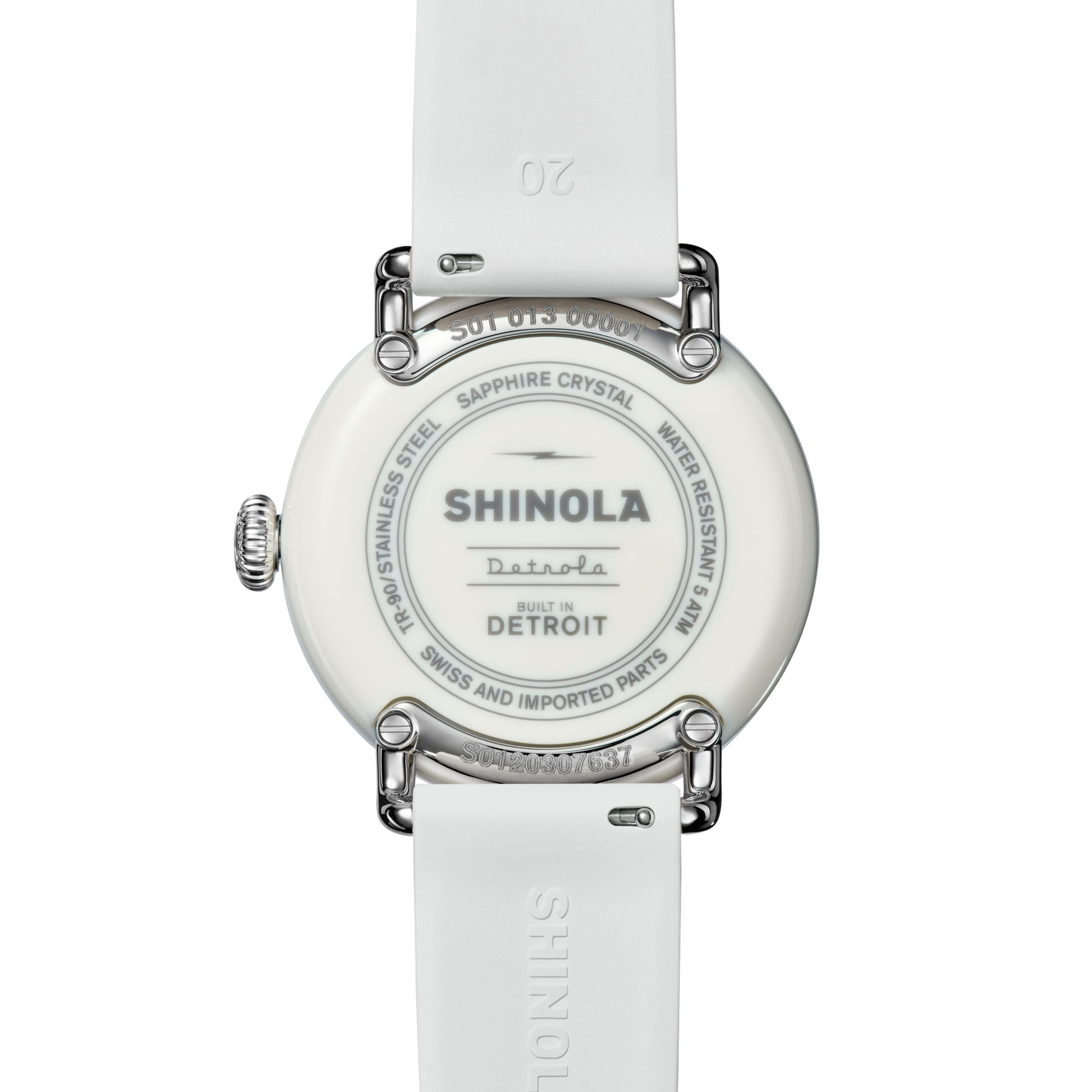 Back view of the Shinola Detrola Watch - Nude, featuring a white strap and an engraved case back: "Shinola Detroit, Built in Detroit, Swiss and Imported Parts, Stainless Steel, Sapphire Crystal, Water Resistant 5ATM.