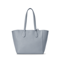The Shinola Runabout Tote Bag - Mist features light blue pebbled leather, two shoulder straps, a structured design, subtle stitching, and an interior zipper pouch, shown against a plain white background.