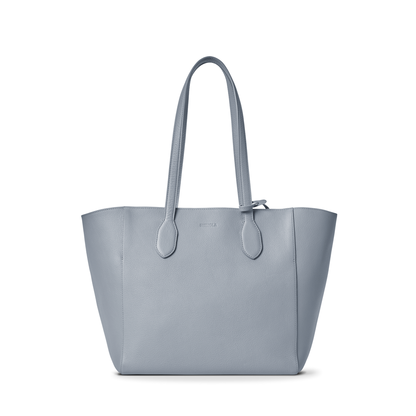The Shinola Runabout Tote Bag - Mist features light blue pebbled leather, two shoulder straps, a structured design, subtle stitching, and an interior zipper pouch, shown against a plain white background.