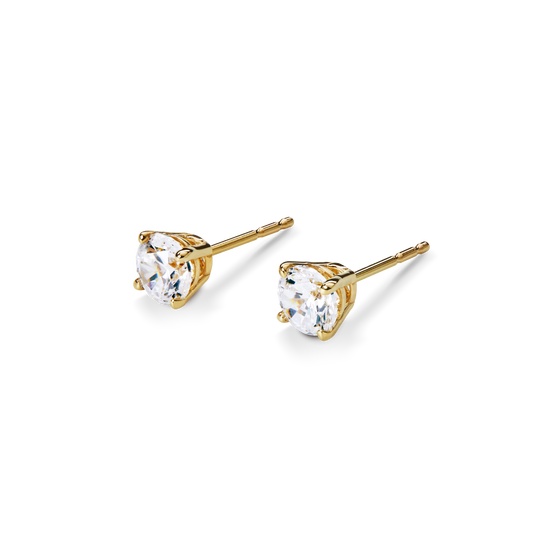 Shinola's 1 Carat Round Diamond Studs in yellow gold feature classic three-prong settings, showcased against a plain white background.