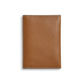 The Shinola Folded Card Holder Wallet - Tan features light brown Italian Vachetta leather with visible edge stitching, shown closed and flat on a white background. This slim wallet offers both elegance and practicality.