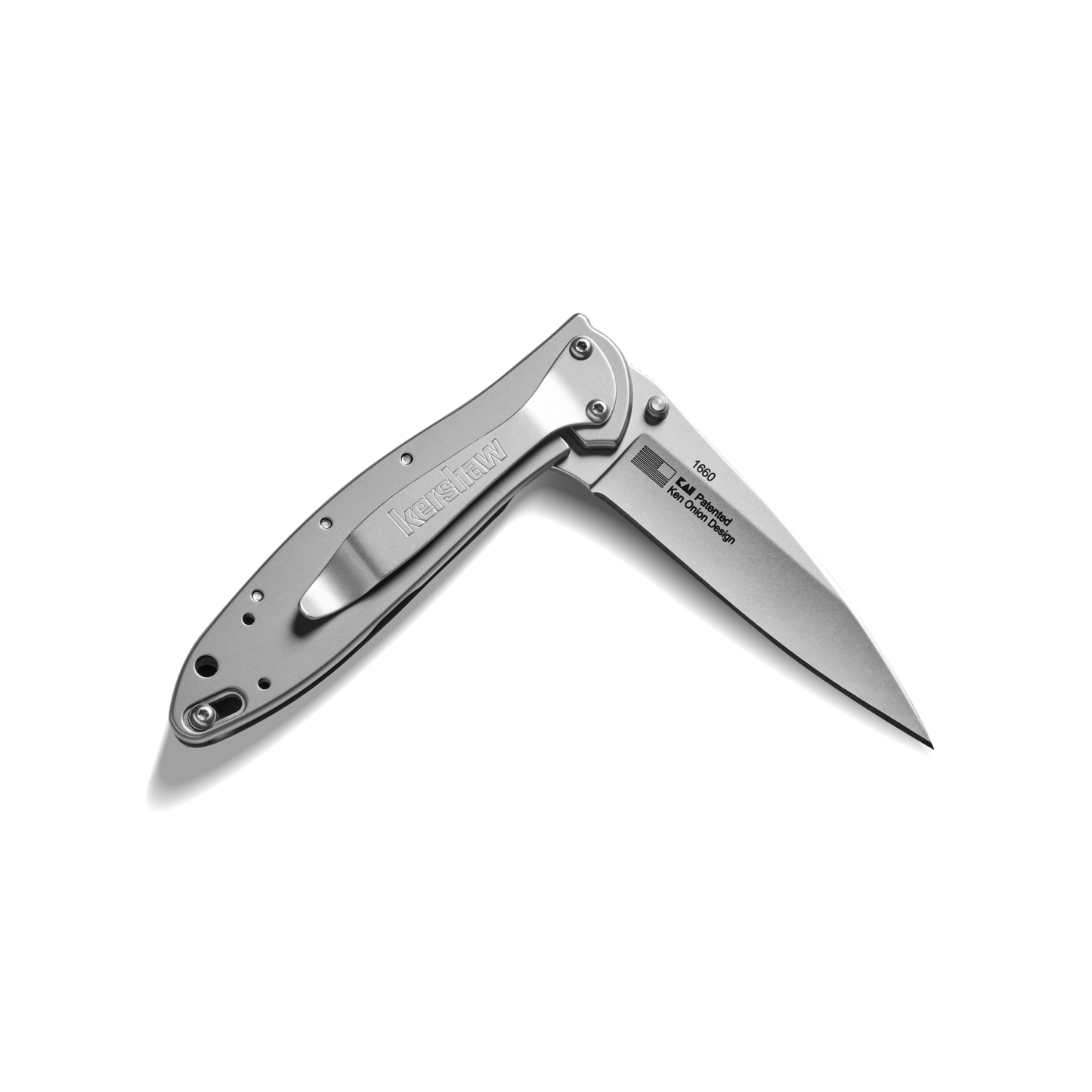 A Shinola + Kershaw Petoskey Stone Pocket Knife with a partially open, pointed blade and a sleek metal handle is shown against a plain white background.