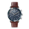 The Shinola Canfield Sport Chronograph Watch - Midnight Blue features a blue dial with silver hands and markings, three subdials, a chronograph function, and a brown leather strap. The watch face reads Shinola Detroit on a plain white background.