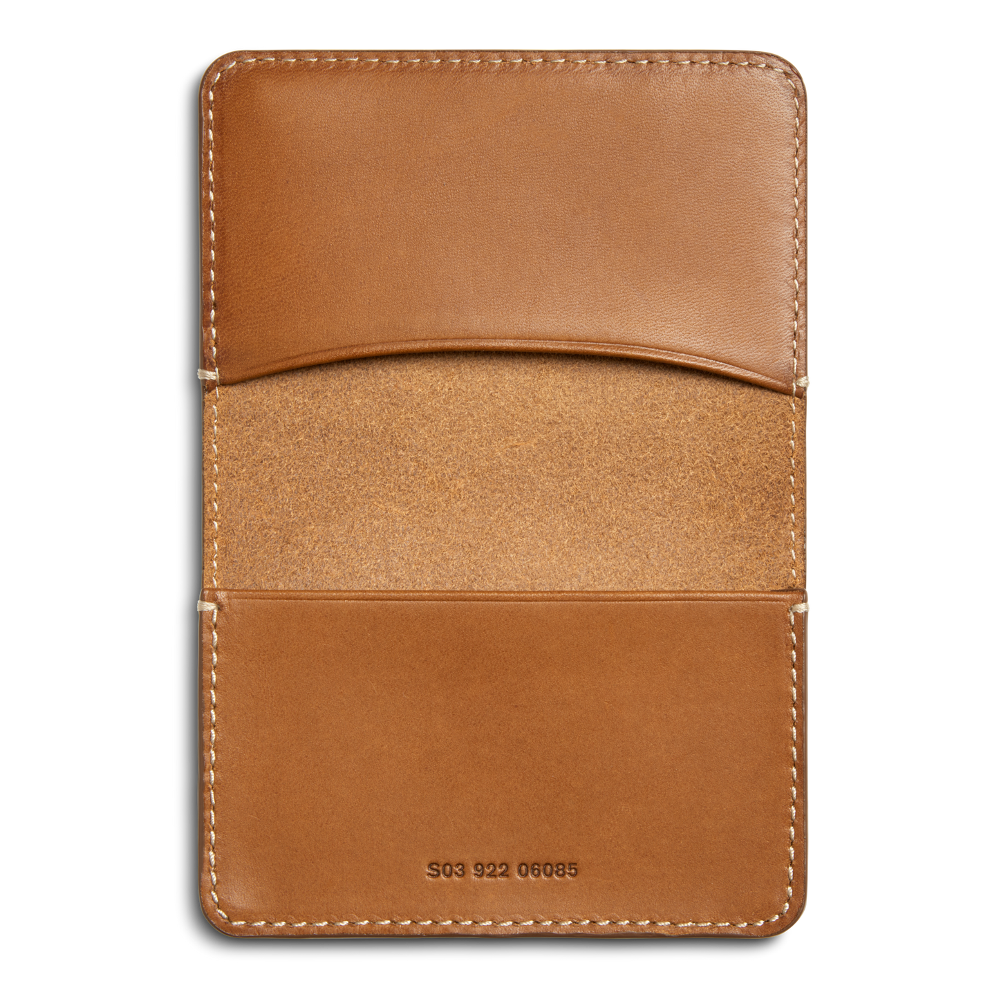 The Shinola Business Card Holder - Tan is crafted from Italian Vachetta leather, features two slots, exposed edge stitching, a unique S03 922 06085 serial number stamped at the bottom center, and a slightly textured interior.