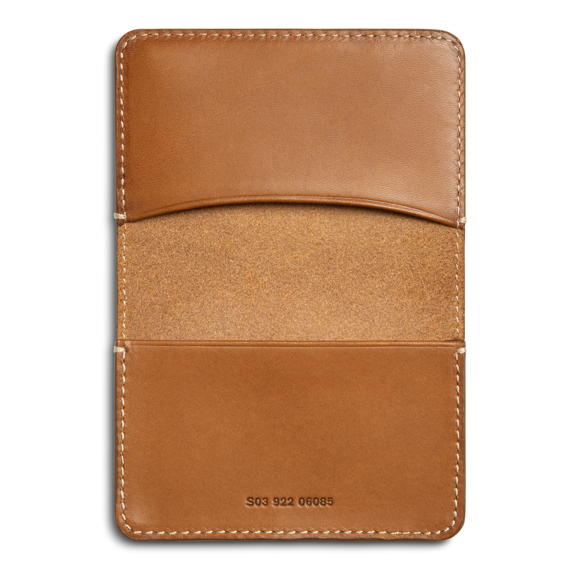 The Shinola Business Card Holder - Tan is crafted from Italian Vachetta leather, features two slots, exposed edge stitching, a unique S03 922 06085 serial number stamped at the bottom center, and a slightly textured interior.