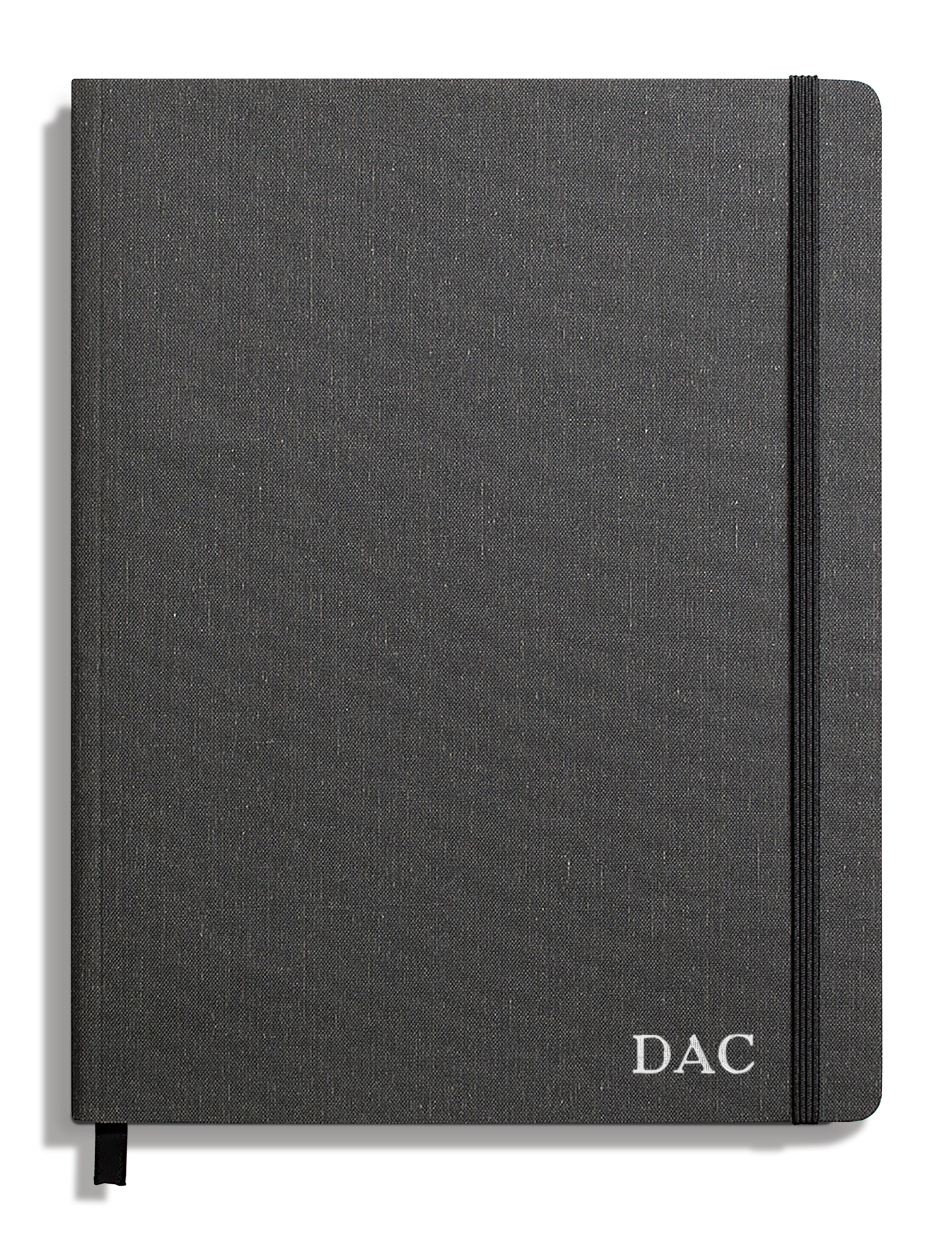 The Shinola Large Soft Ruled Journal in Charcoal features a smyth-sewn binding, a black elastic closure on the right edge, and the initials DAC printed in white on the lower right of its dark gray fabric cover.