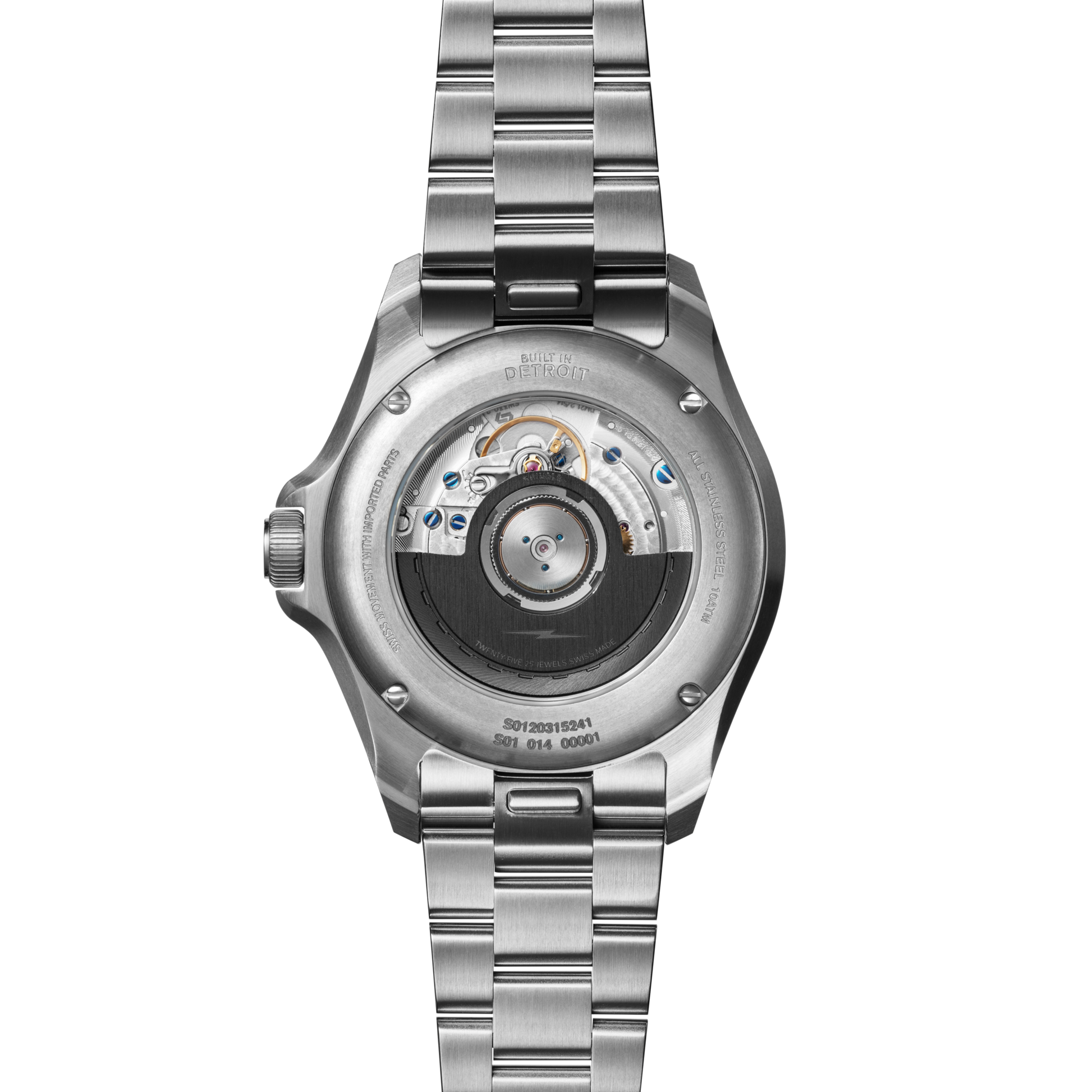 The image displays the back of the Shinola Monster Worldtimer GMT Watch, highlighting its stainless steel bracelet, transparent case back with visible automatic movement, and engraved details.