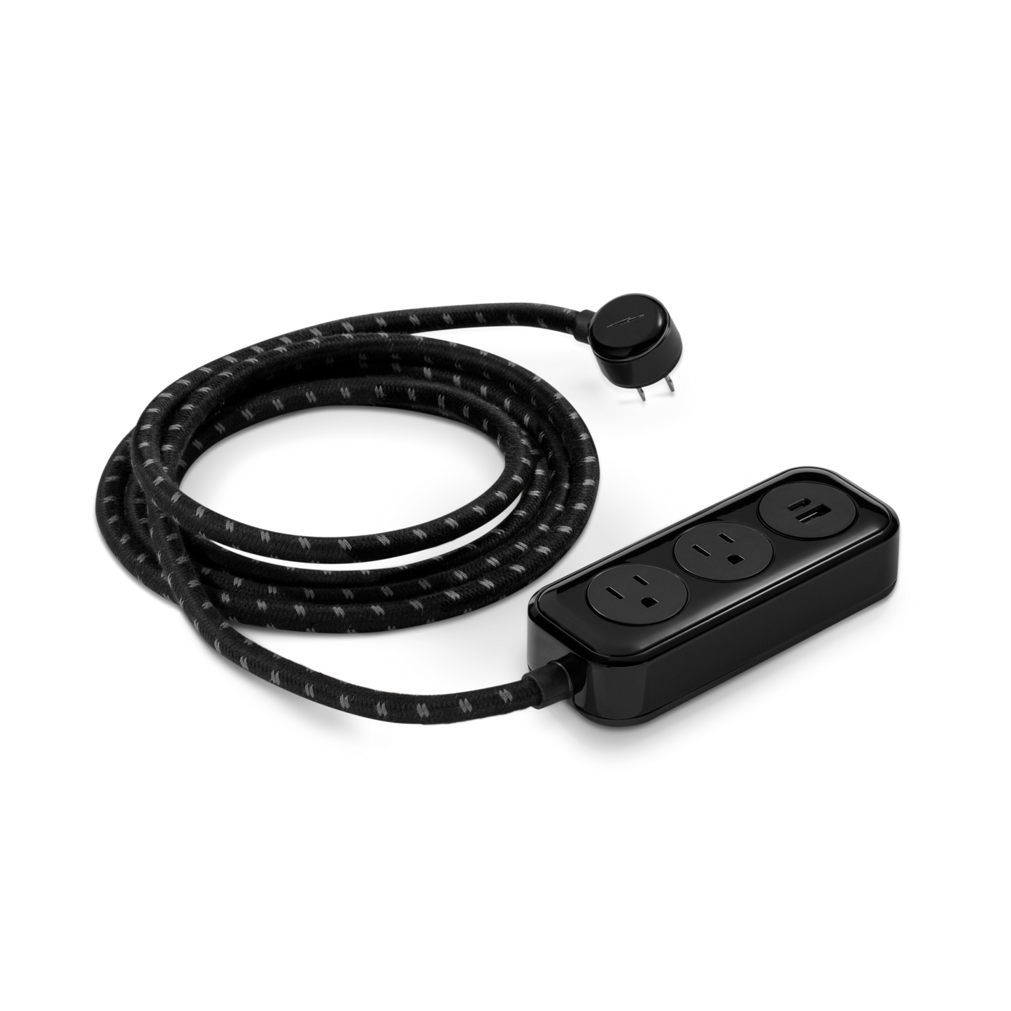 The Shinola 2 Port Power Supply - Black features a braided extension cord with a right-angle plug, two standard outlets, and a USB port. Its modern, compact design includes a dual port quick charger on a plain white background.