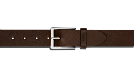 A close-up of the Shinola 1 1/2" Lightning Bolt Keeper Belt in deep brown leather, featuring a shiny silver-tone rectangular buckle and hardware, displayed on a plain white background.