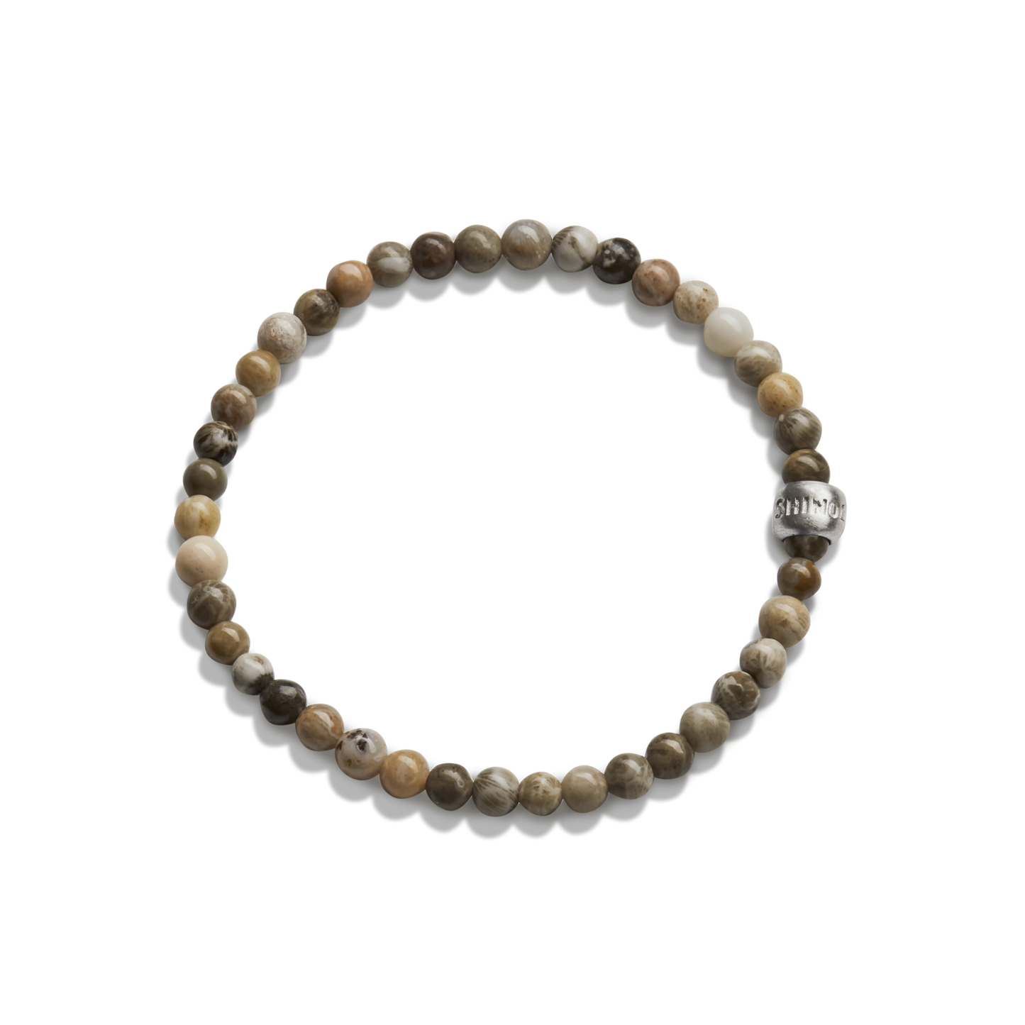 The Shinola 4mm Beaded Petoskey Bracelet features small, round Petoskey stones in brown, beige, and gray with a single engraved sterling silver accent bead.