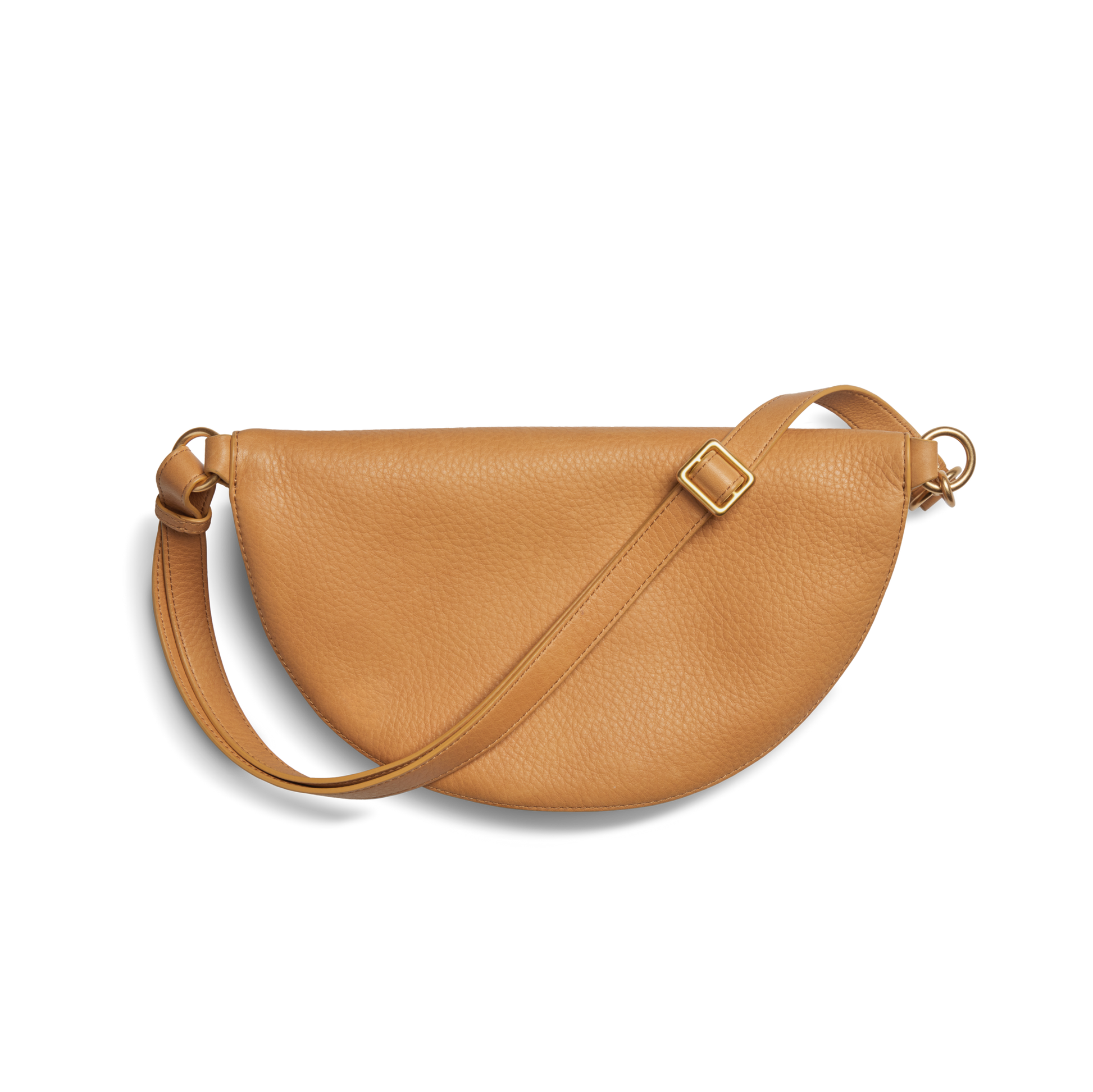 The Shinola Sling Bag - Honey is a tan leather half-moon bag with an adjustable strap and gold-tone buckle, shown against a plain white background.
