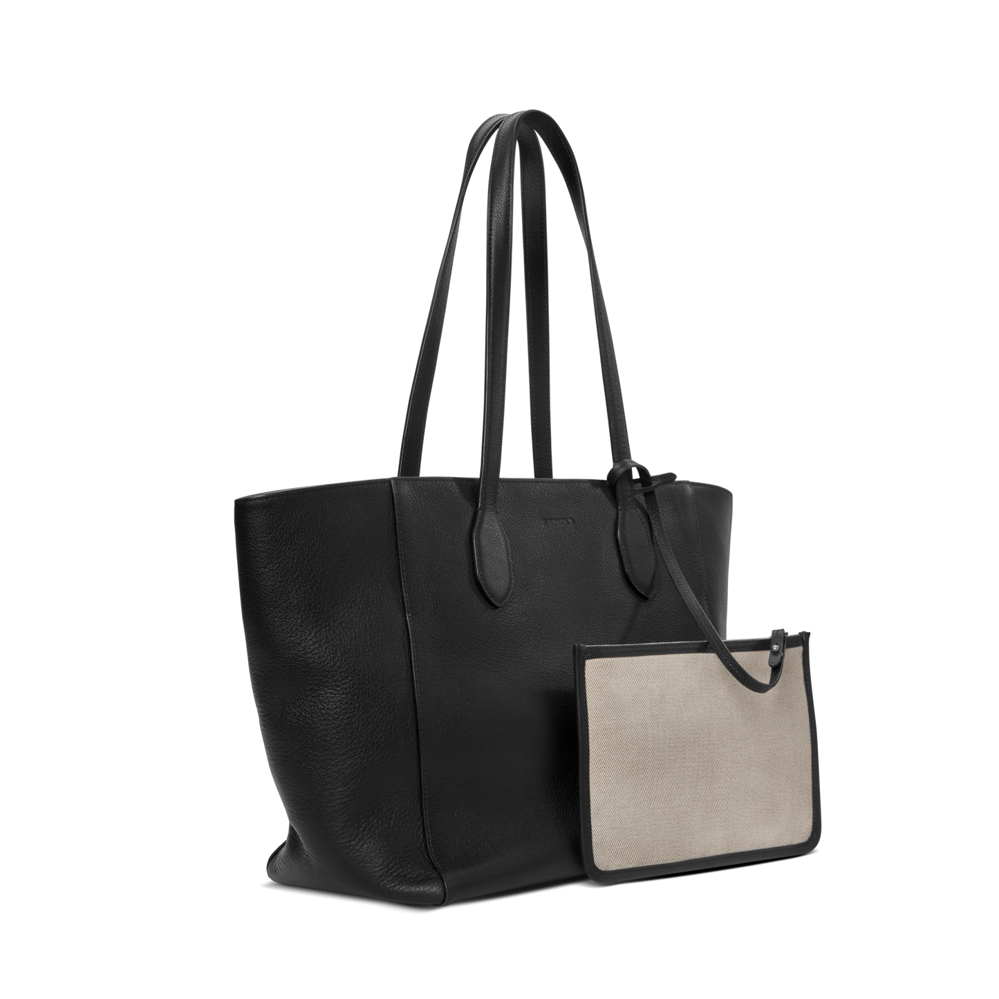 The Shinola Runabout Tote Bag in black pebbled leather with dual shoulder straps is shown alongside a small beige rectangular zipper pouch with black trim, both set against a plain white backdrop.