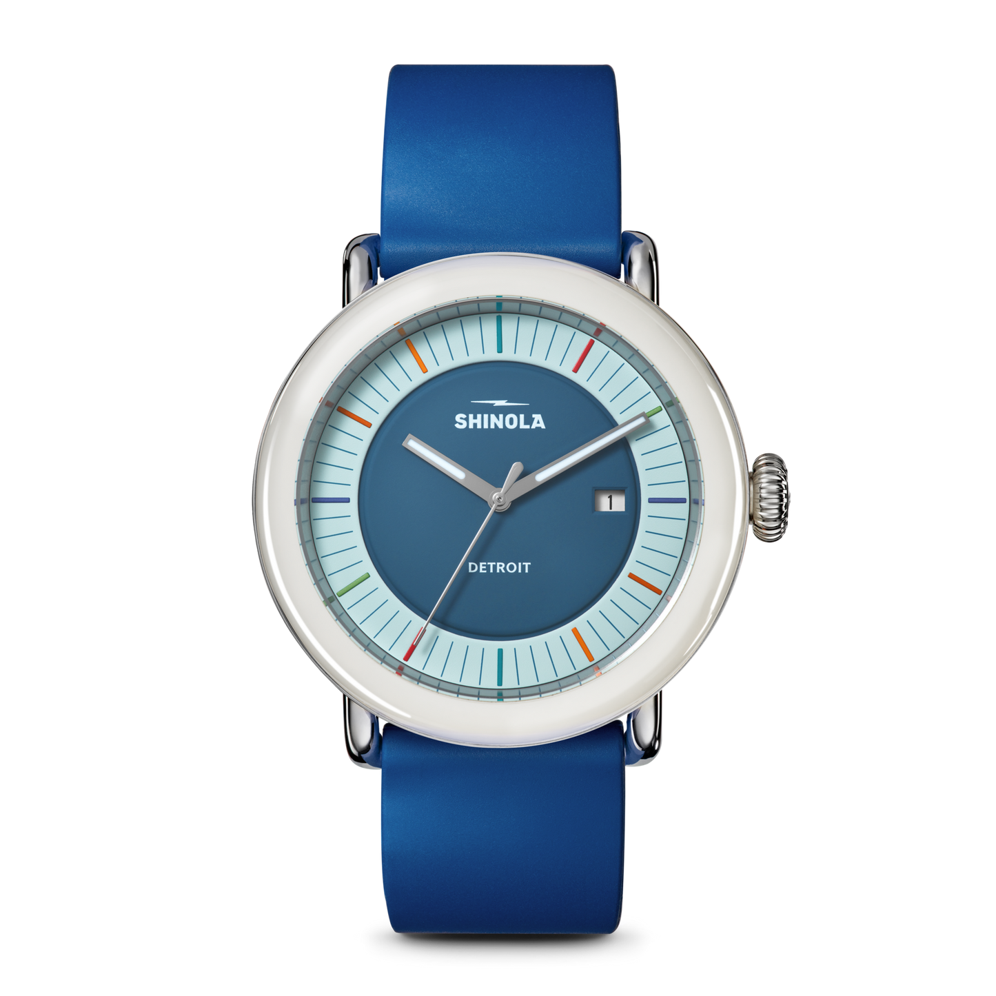The Shinola Detrola Watch - Blue features a round face with a silver bezel, blue dial, minimalist markers, date at 3 o’clock, and a blue leather strap—a contemporary accessory for modern style.