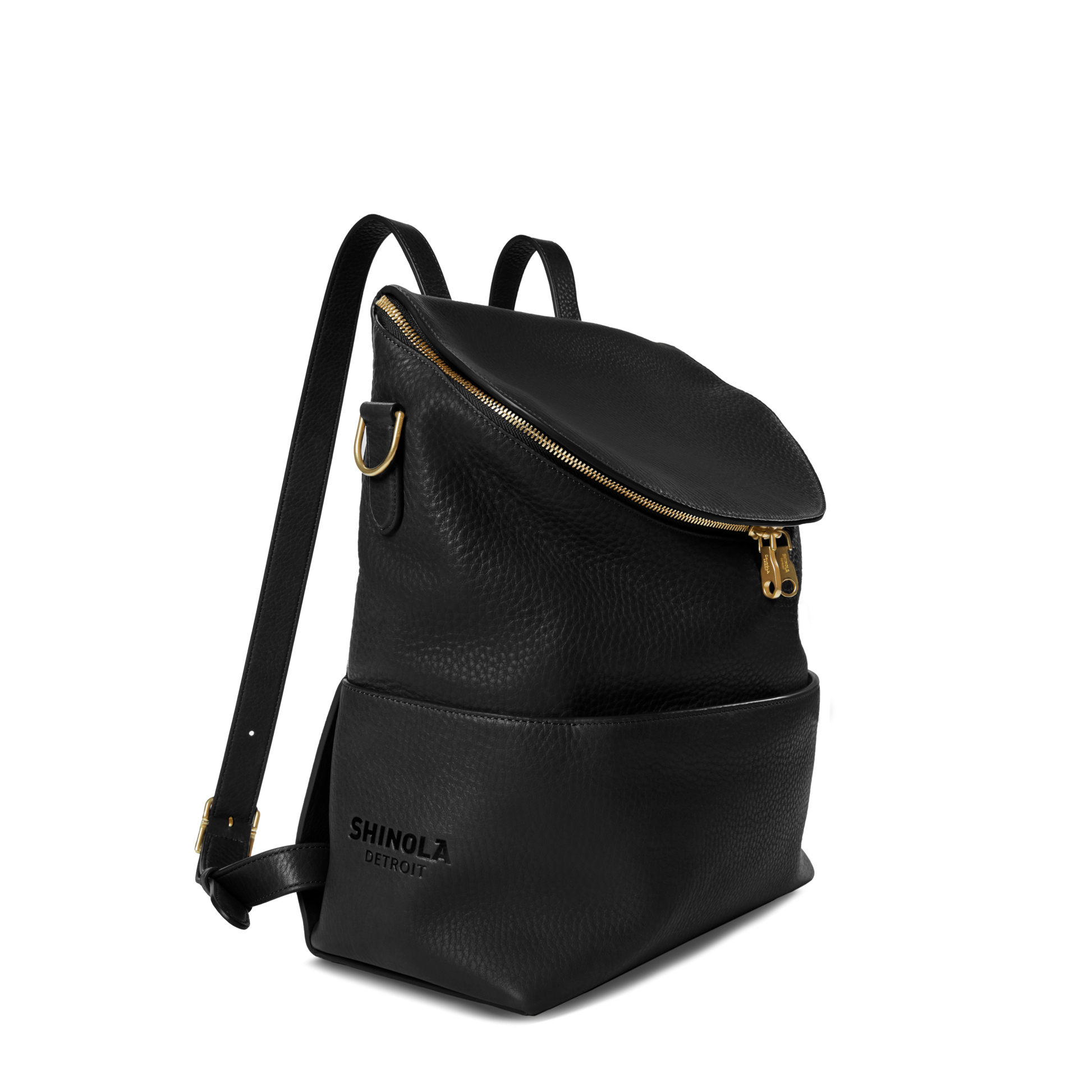The Shinola Convertible Pocket Backpack - Brand Stripe / Black features a gold zipper, front pocket, and adjustable shoulder straps for hands-free convenience, shown on a white background.