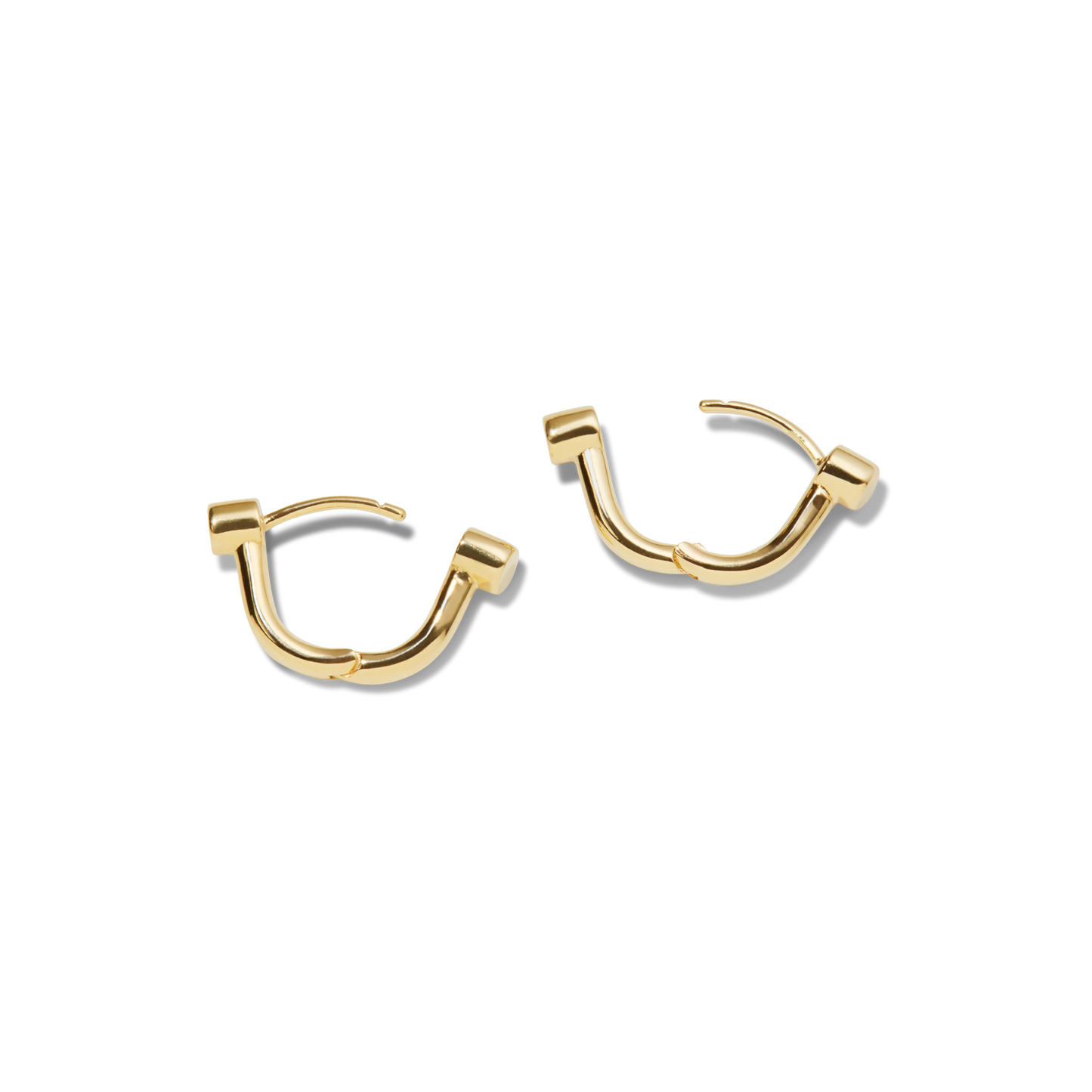 The Shinola Bike Lock Huggie Earrings in yellow gold feature a modern geometric design, making them ideal for everyday wear. Shown against a plain white background.
