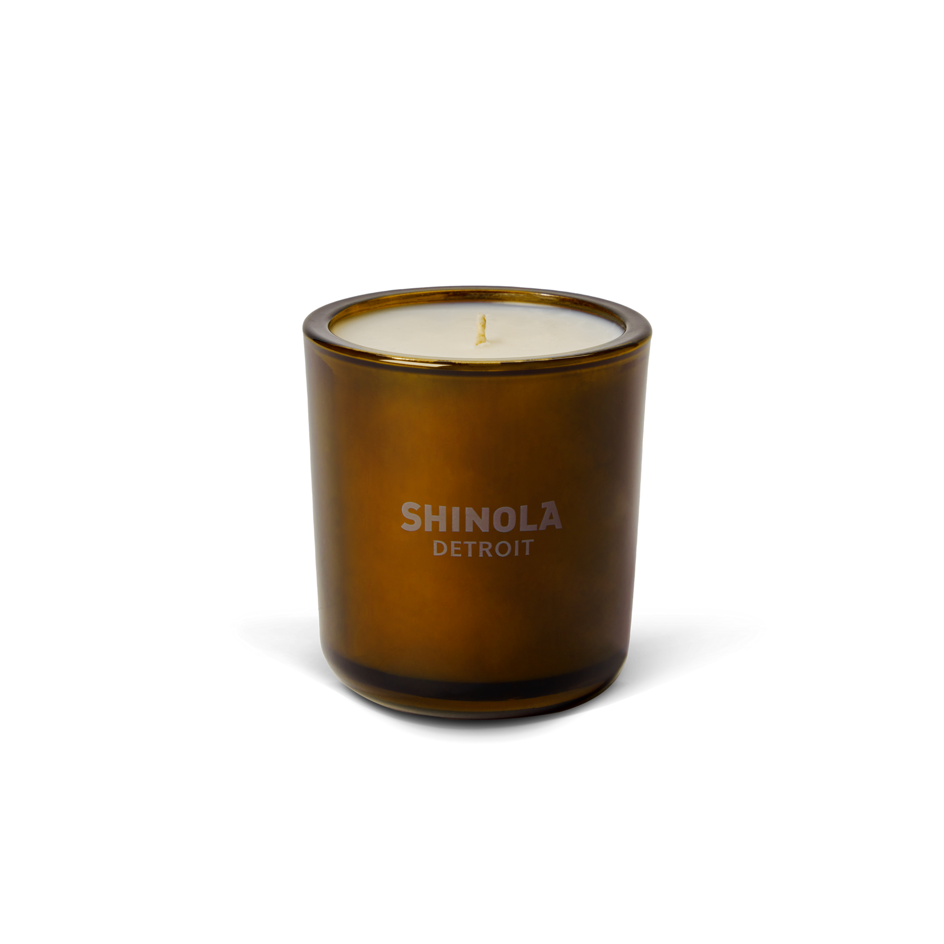 The Shinola Hotel 8oz Scented Candle features premium coconut soy wax in a brown recycled glass vessel with a single wick and "Shinola Detroit" label, displayed on a plain white background.
