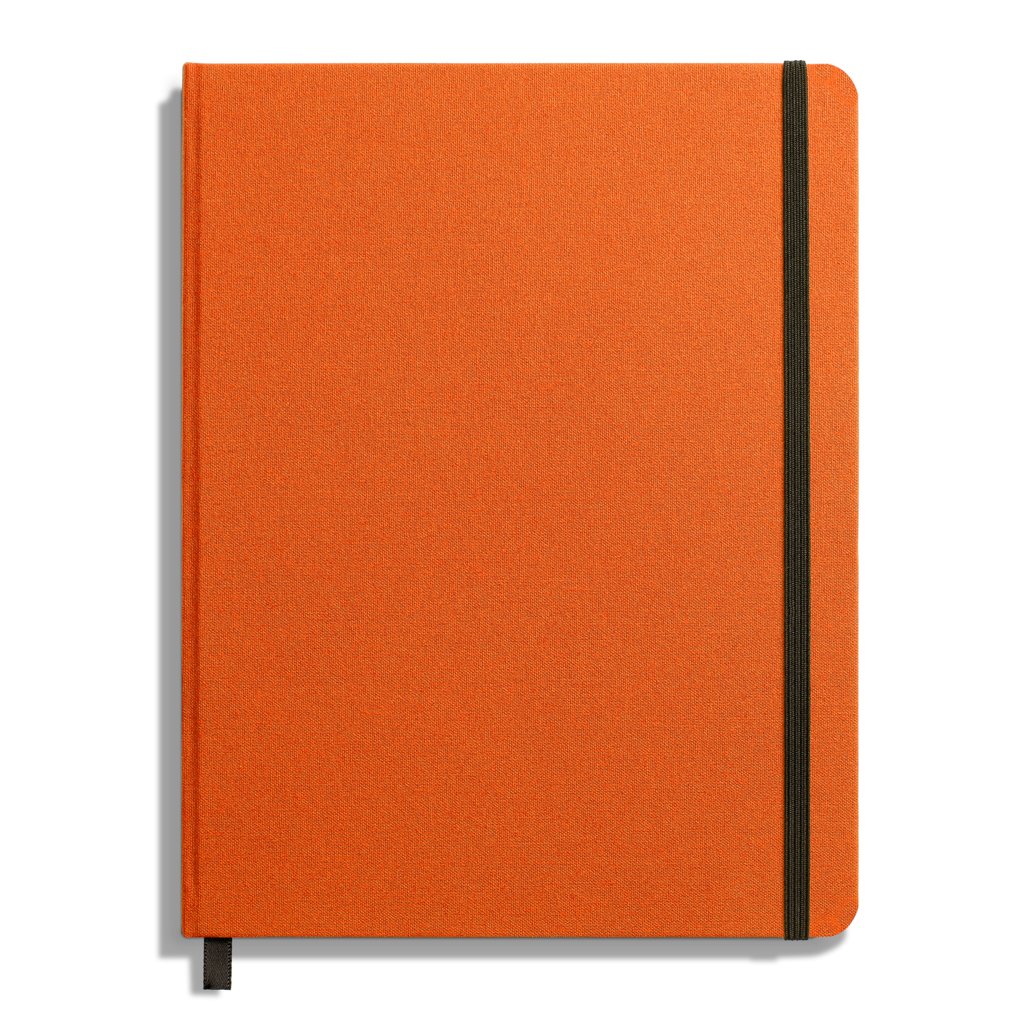 The Shinola Large Hard Ruled Journal in Bold Orange features a closed hard linen cover, a vertical black elastic band on the right side, and a black ribbon bookmark at the bottom edge.