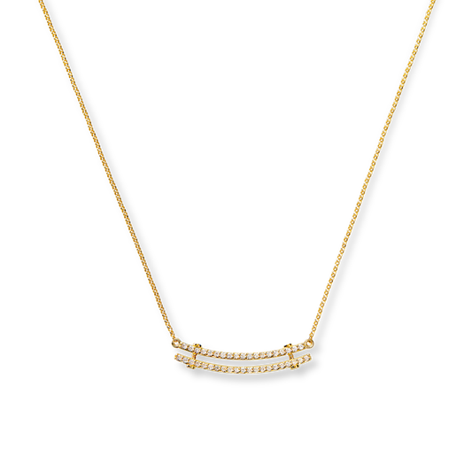The Shinola Diamond Pave Rivet Double Row Necklace in 14k yellow gold features two parallel rows of sparkling white stones set on a slim gold chain, shown against a white background.