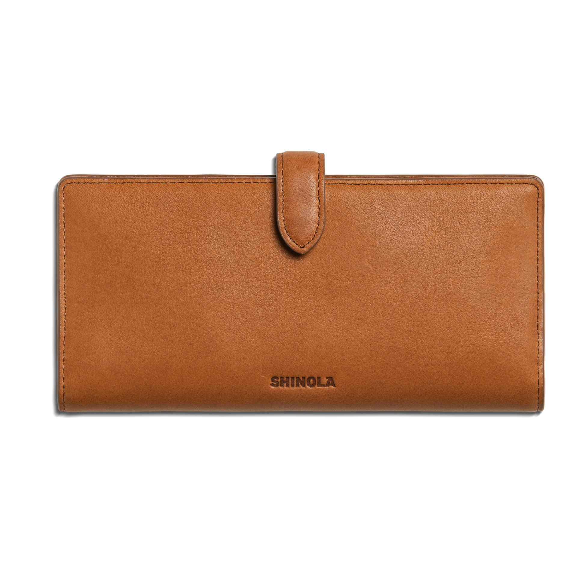 The Shinola Continental Snap Wallet - Tan is made from natural leather, featuring a slim design, flap with snap closure, and Shinola embossed on the front center. Shown against a plain white background.