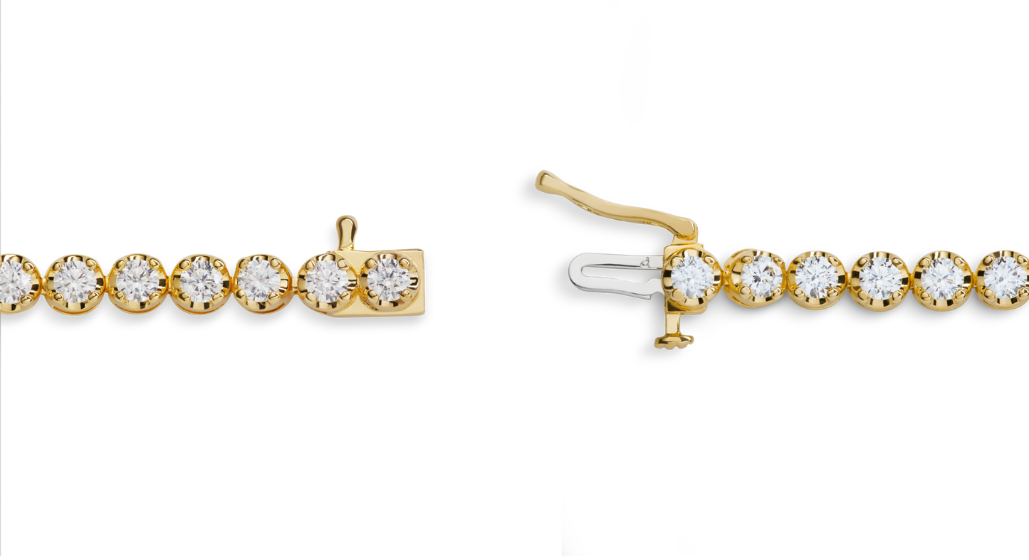 A close-up of the Shinola 4 Carat 7" Diamond Tennis Bracelet in yellow gold, featuring round Brilliant Cut Diamonds and an open box clasp, displayed on a white background.