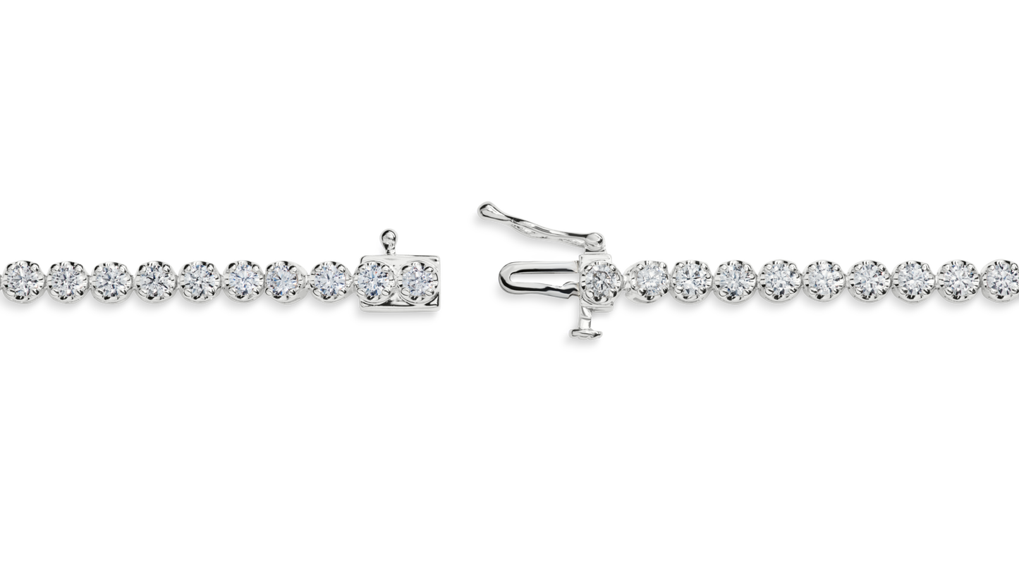 The Shinola 3 Carat 7" Diamond Tennis Bracelet in white gold is shown laid flat, featuring closely set brilliant cut diamonds in a continuous line with its box clasp and safety latch open to display both ends.
